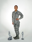 Tech. Sgt.  Dorothy Dingba, 67th Cyberspace Wing manpower analyst, poses with the trophies she won during the 34th annual Lackland Bodybuilding Classic, Nov. 8. (U.S. Air Force photo/ Senior Airman Lynsie Nichols)