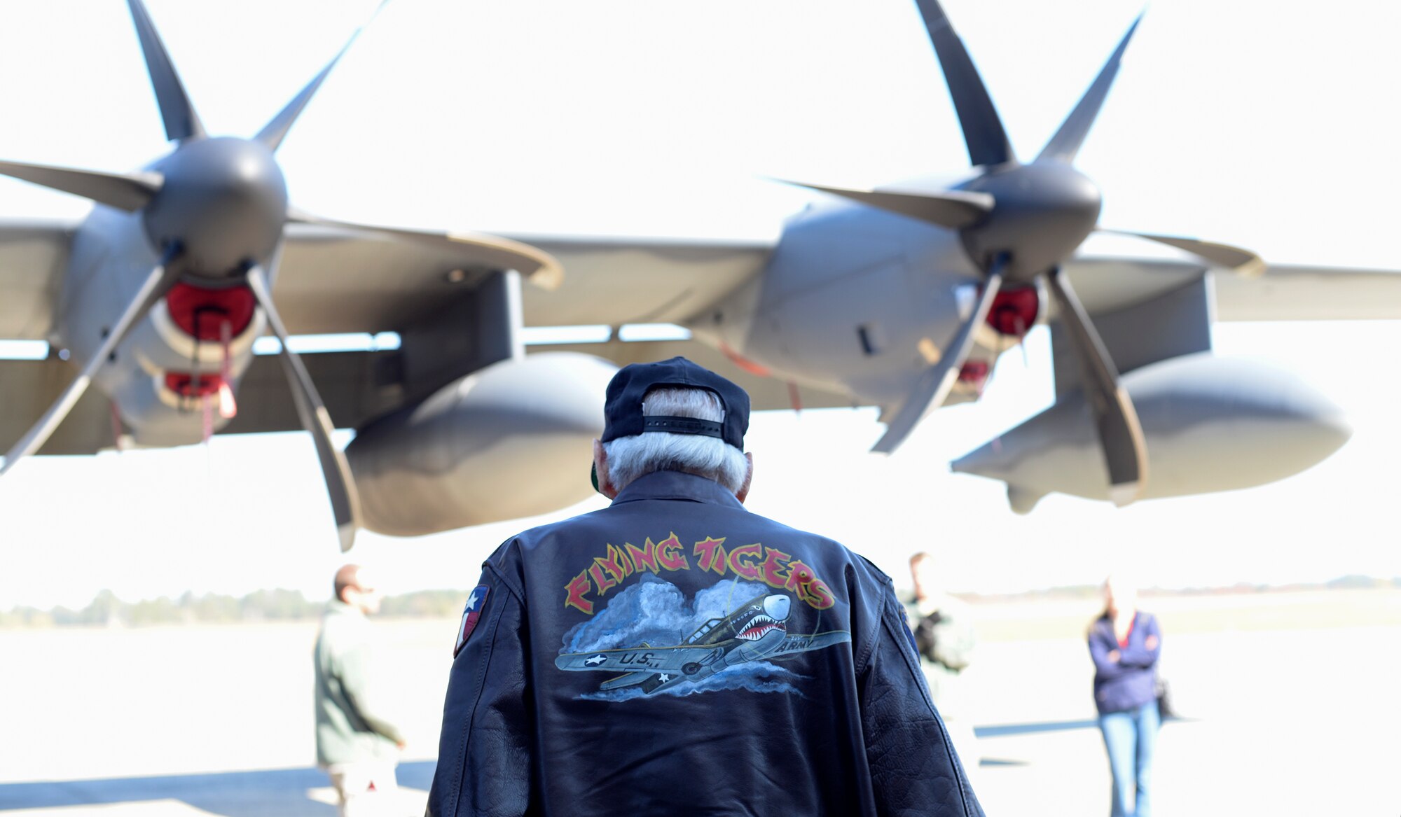 J.M. Taylor, a former 75th Fighter Squadron pilot and World War II veteran, walks toward an HC-130J Combat King II during the 2014 Flying Tiger Reunion heritage day, Nov. 14, 2014, at Moody Air Force Base, Ga.  Taylor enlisted in the Army Cadet program on Sept. 16, 1942 and graduated flying training at Spence Field in Moultrie, Ga., Dec. 5, 1943. (U.S. Air Force photo by Master Sgt. Sonny Cohrs/Released)