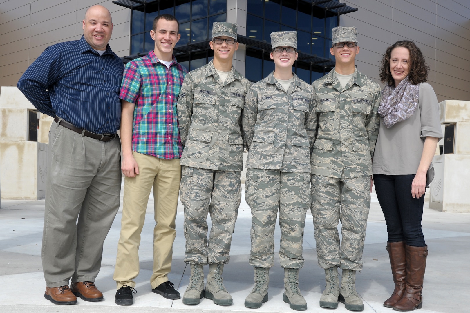 From left to right, Frankie, Frank, Brian, Brittany, Trevor and Wendy Petrine stand together in front of the Pfingston Reception Center Nov. 7 at Joint Base San Antonio-Lackland. Brian and Trevor are twins and graduated that day from basic military training with their younger sister Brittany.  
Photo by Staff Sgt. Delia Marchick.(U.S. Air Force photo/Staff Sgt. Delia Marchick)
