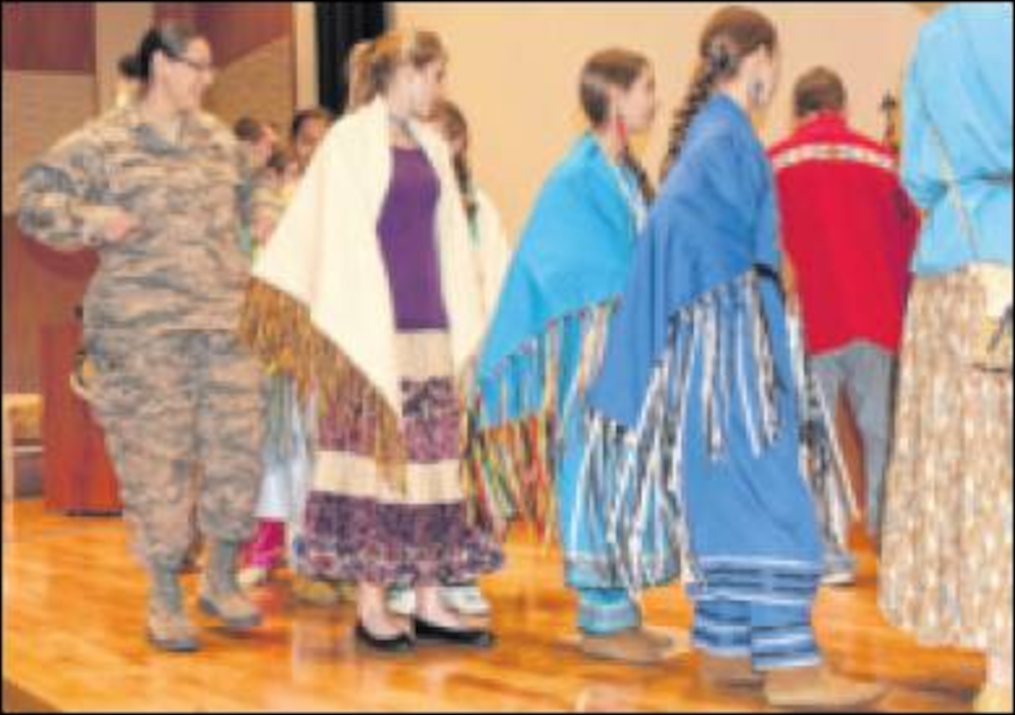 Tech. Sgt. Christine Carter, National Air and Space Intelligence Center, participates in a traditional Native American blanket dance. (Air Force photo by Staff Sgt. Eunique Thomas) 