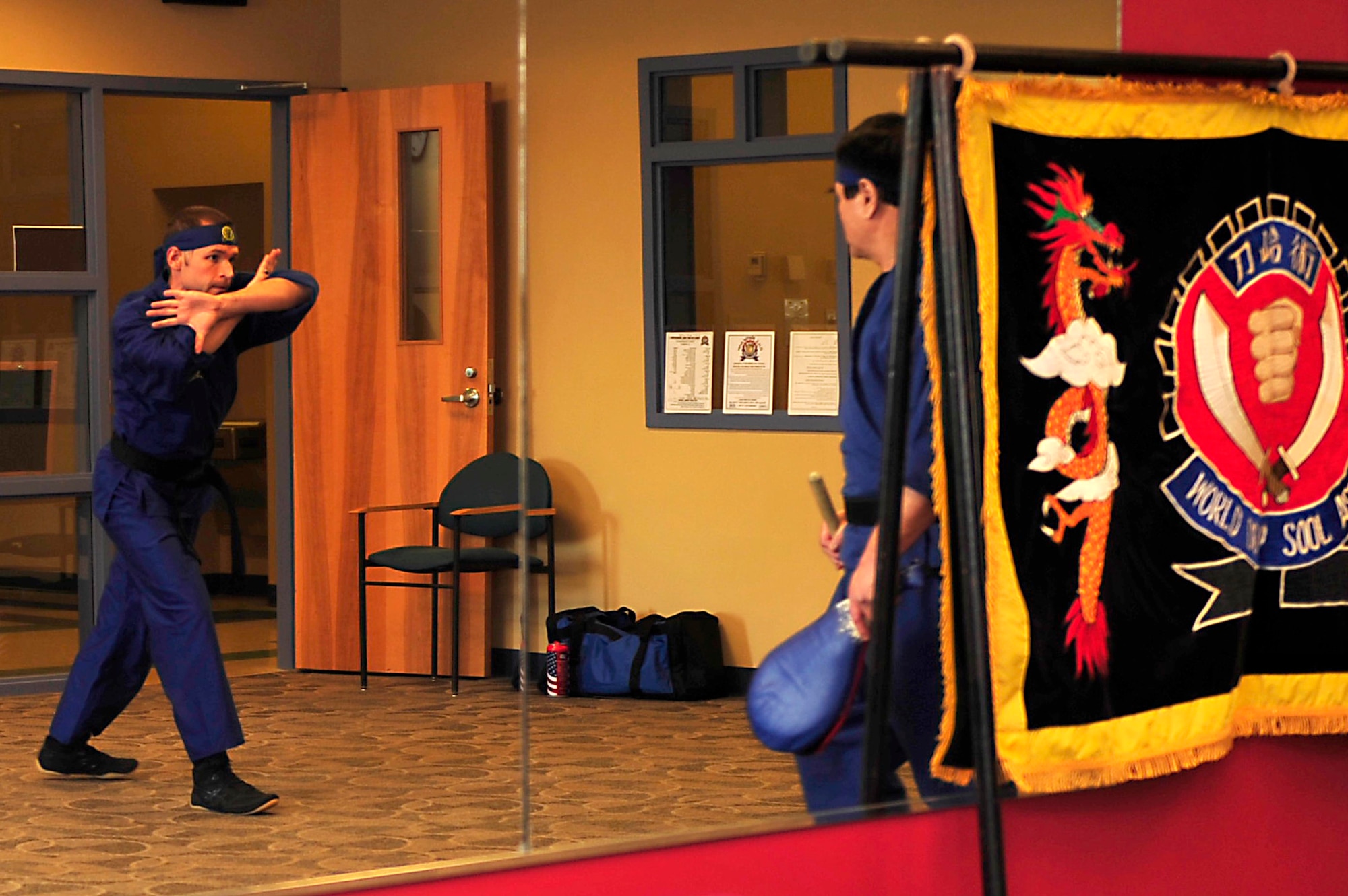 A participant preforms kata with In Hwan Chung, Do Hap Sool founder and president, at the Community Commons at Langley Air Force Base, Va., Oct. 20, 2014. Do Hap Sool means weapons, natural things, and skill or technique. (U.S. Air Force photo by Airman 1st Class Breonna Veal/Released)