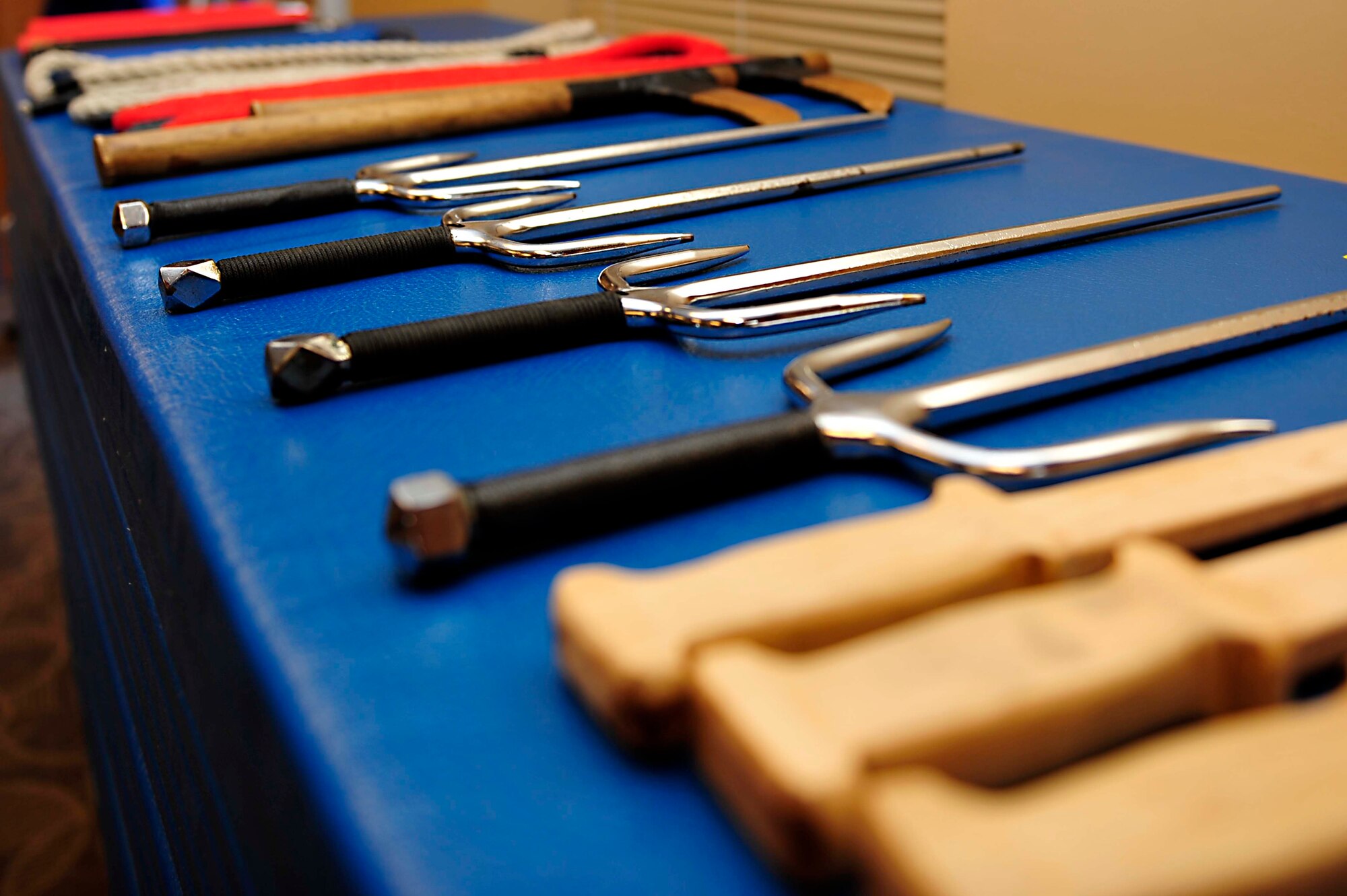 Wooden swords and plastic props, used for Do Hap Sool, are placed on a stack of mats at the Community Commons at Langley Air Force Base, Va., Oct. 20, 2014. Do Hap Sool focuses on actual combat situations in which blows can be fatal. (U.S. Air Force photo by Airman 1st Class Breonna Veal/Released)