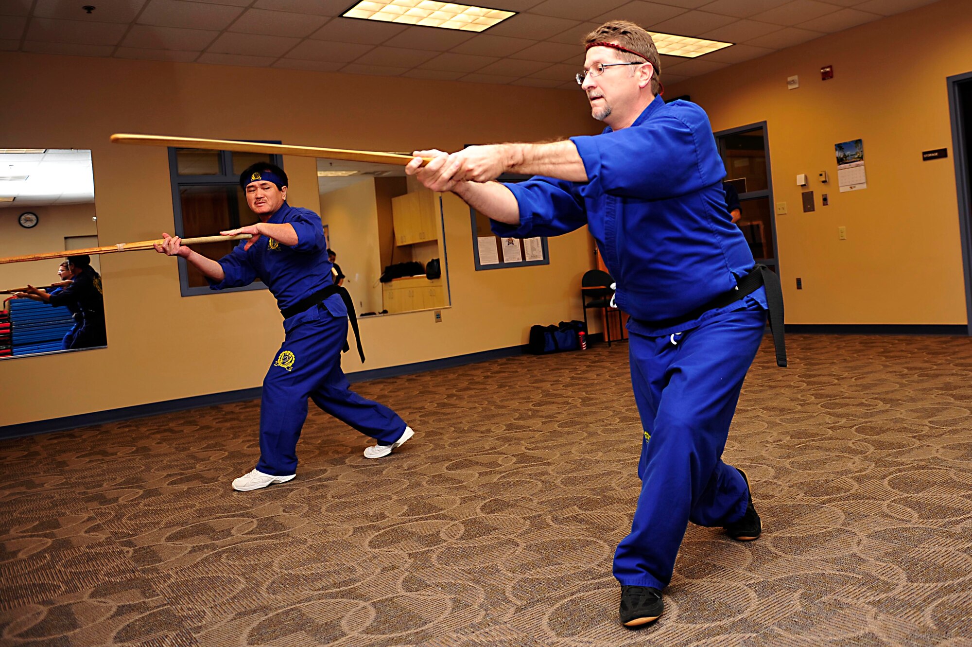 In Hwan Chung, Do Hap Sool founder and president, performs kata with Ray Snyder, 480th Intelligence, Surveillance and Reconnaissance Wing contract support technician, at the Community Commons at Langley Air Force Base, Va., Oct. 20, 2014. Do Hap Sool, a form of martial arts, is a non-competitive sport that teaches true self-defense. (U.S. Air Force photo by Airman 1st Class Breonna Veal/Released) 