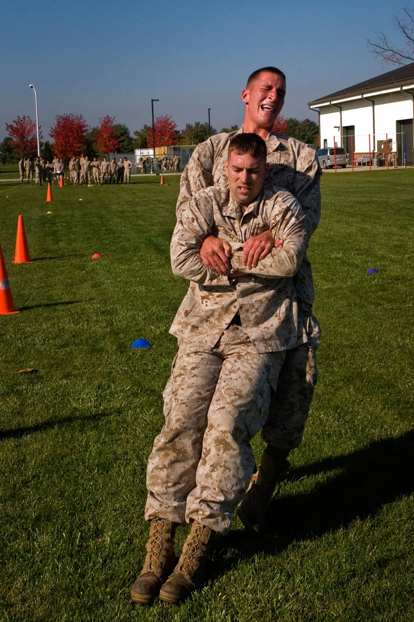 U.S. Marine Corps Lance Cpl. Damon Yokum, Detachment 1, Communication Company, Combat Logistics Regiment 45, 4th Marine Logistics Group ground radio repairer, buddy carries U.S. Marine Cpl. William Hodestyn, Detachment 1 field radio operator, during their annual combat fitness test at Grissom Air Reserve Base, Ind., Oct. 25, 2014. CFTs ensure Marines are capable of conducting combat day-to day operations. (U.S. Air Force photo/Senior Airman Jami K. Lancette)