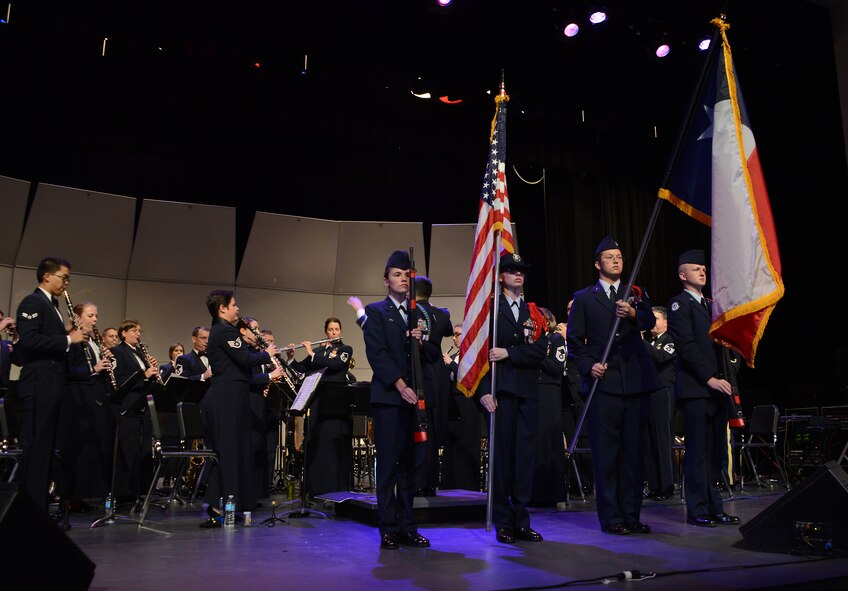 The Cooper High School JROTC serves as the color guard before a musical presentation by the Air Force band of the West Nov. 9, 2014, at Hardin-Simmons University in Abilene, Texas. The color guard was joined by the Air Force Band of the West performing the national anthem. (U.S. Air Force photo by Senior Airman Peter Thompson/Released)