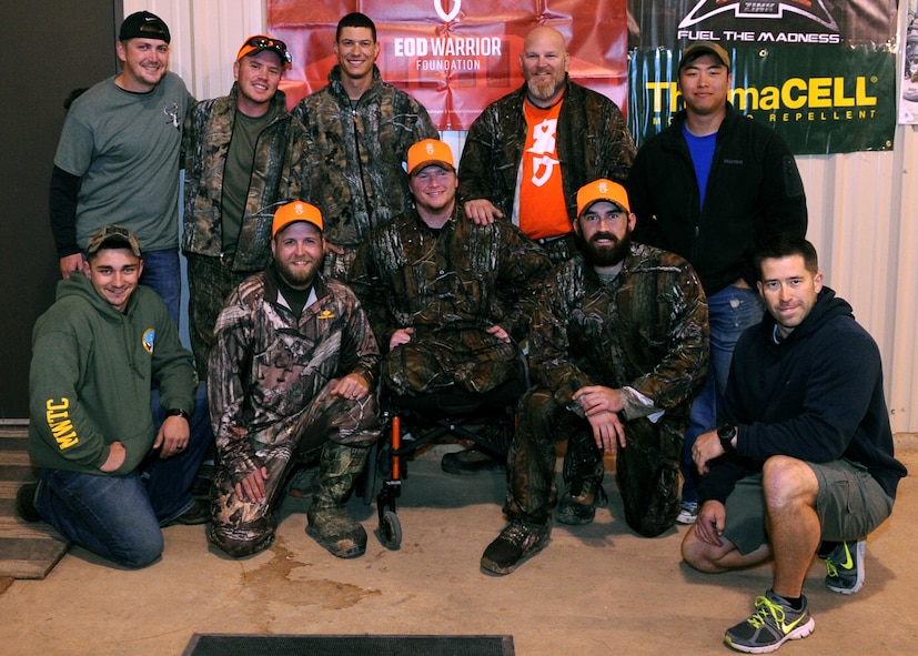 Participants in the Barksdale Wounded Warrior hunt pose with Airmen from the 2nd Civil Engineer Squadron Explosive Ordinance Disposal Unit on Barksdale Air Force Base, La., Nov. 10, 2014. The third annual hunt was hosted by the Barksdale Wounded Warrior Association to help give wounded service members a therapeutic weekend of fun and relaxation through a hunting trip. (U.S. Air Force photo/Senior Airman Kristin High)