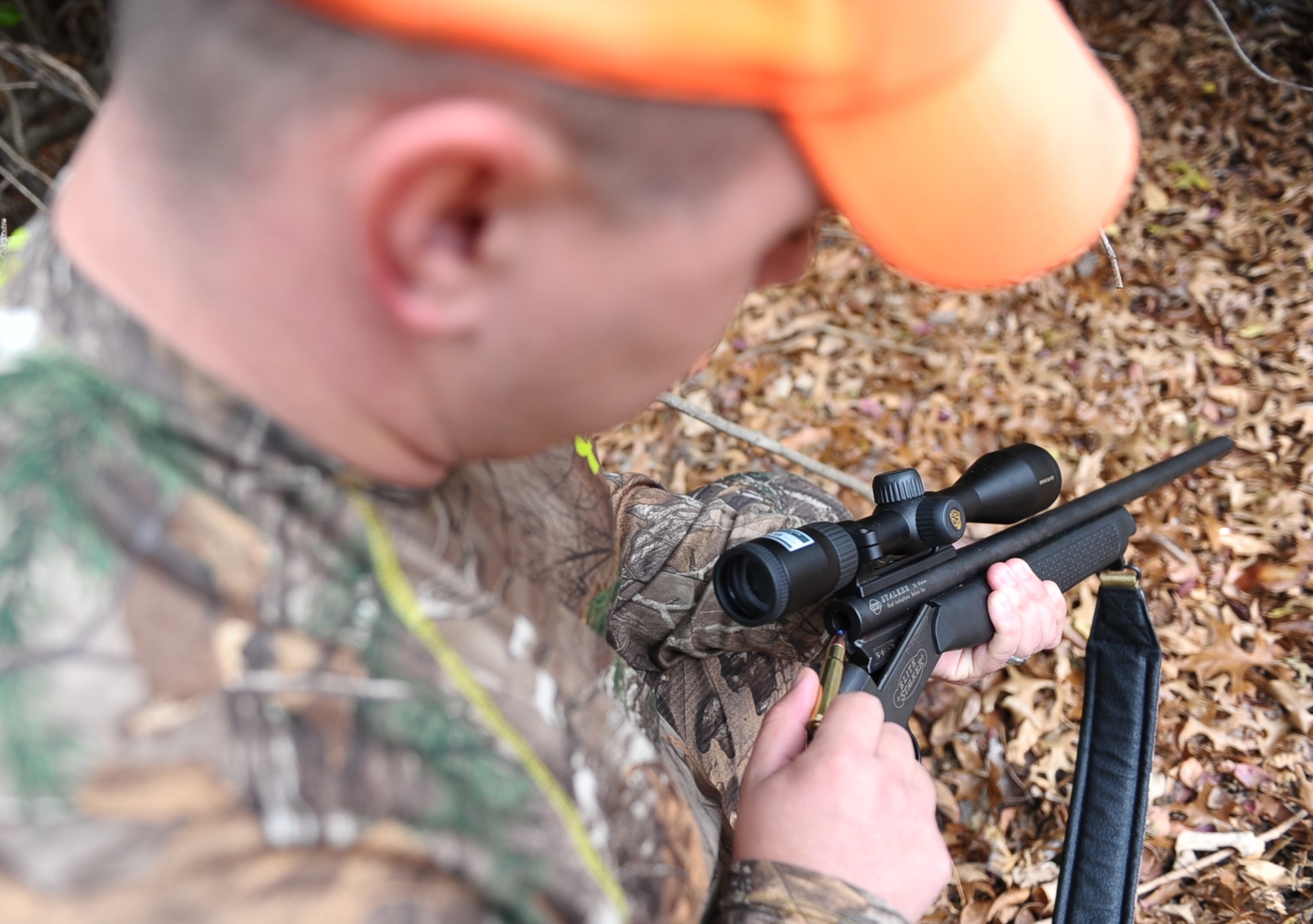Staff Sgt. Cody Howk, 14th Operations Support Squadron Weather Forecaster, loads a bullet into a 35 Whelen rifle while hunting Nov. 12 outside Columbus Air Force Base. It is always a good idea to carry at least five bullets while hunting. If in an emergency situation, firing three shots into the ground is a signal of distress to other hunters and emergency services. (U.S. Air Force photo/Airman Daniel Lile)