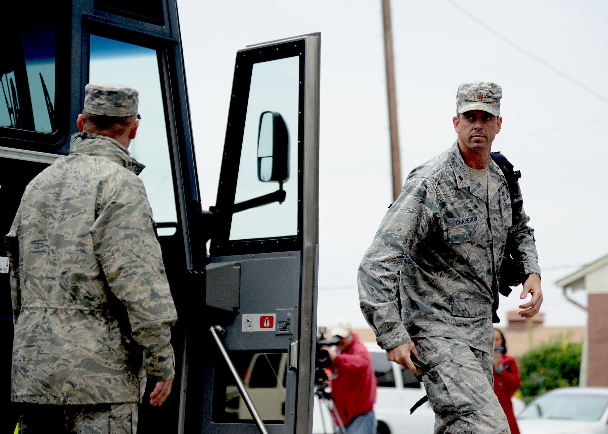 U.S. Air Force Maj. Jeffrey Chaperon, 633rd Medical Support Squadron, disembarks a coach bus upon arrival at the Langley Transit Center at Langley Air Force Base, Va., Nov. 13, 2014. Chaperon was among 90 U.S. military personnel returning from fighting the spread of Ebola in West Africa that will undergo a 21-day controlled monitoring period at Langley before reintegration with their home unit and duty station. (U.S. Air Force photo by Staff Sgt. Jason J. Brown/Released)