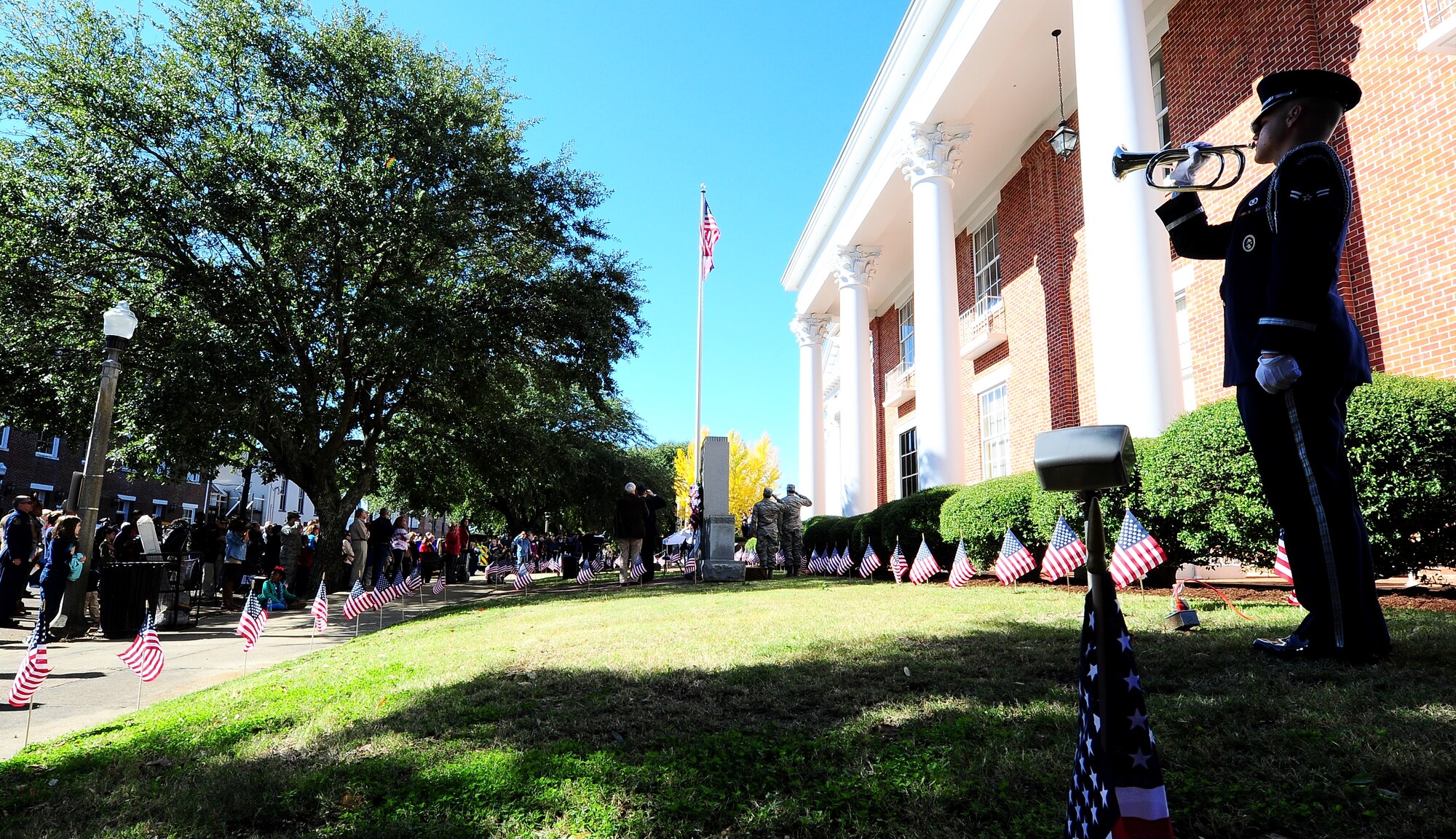 Airman 1st Class Darren Hussey, 14th Flying Training Wing Honor Guardsman, plays Taps at a Veterans Day ceremony Nov. 8 at the Lowndes County Courthouse. The ceremony took place to honor the sacrifices all veterans, past and present, have made. (U.S. Air Force photo/Airman John Day) 