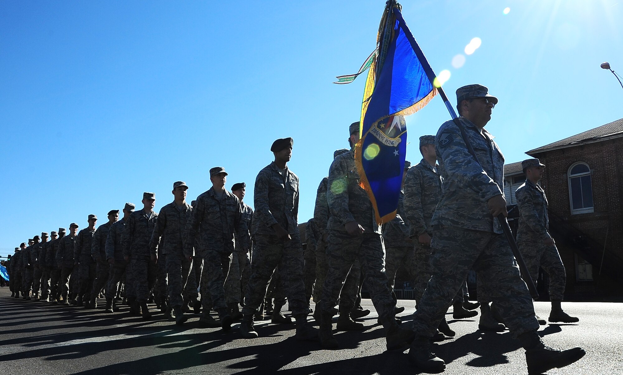 A formation of Airmen from Columbus Air Force Base marches toward the Lowndes County Courthouse during the Veterans Day Parade Nov. 8 in downtown Columbus, Mississippi. The formation was led by Col. Kurt Kayser, 14th Mission Support Group Commander, and Senior Master Sgt. David Sommers, 14th Flying Training Wing Staff Agencies Superintendent. (U.S. Air Force photo/Airman John Day) 