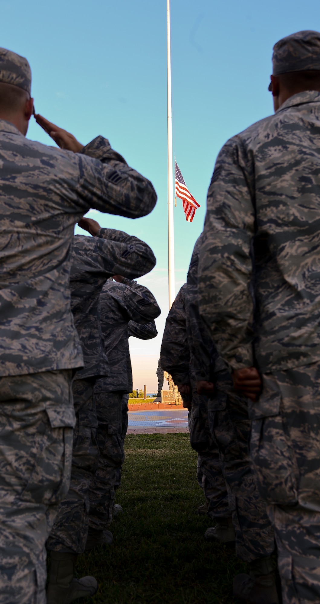 Airmen from the 6th Mission Support Group render a salute as the flag is lowered during a retreat ceremony at Memorial Park on MacDill Air Force Base, Fla., Nov. 12, 2014. In accordance with MacDill AFB Instruction 36-2203, every second Wednesday a different group leads a retreat ceremony at MacDill’s Memorial Park. (U.S. Air Force photo by Senior Airman Melanie Bulow-Gonterman/Released)