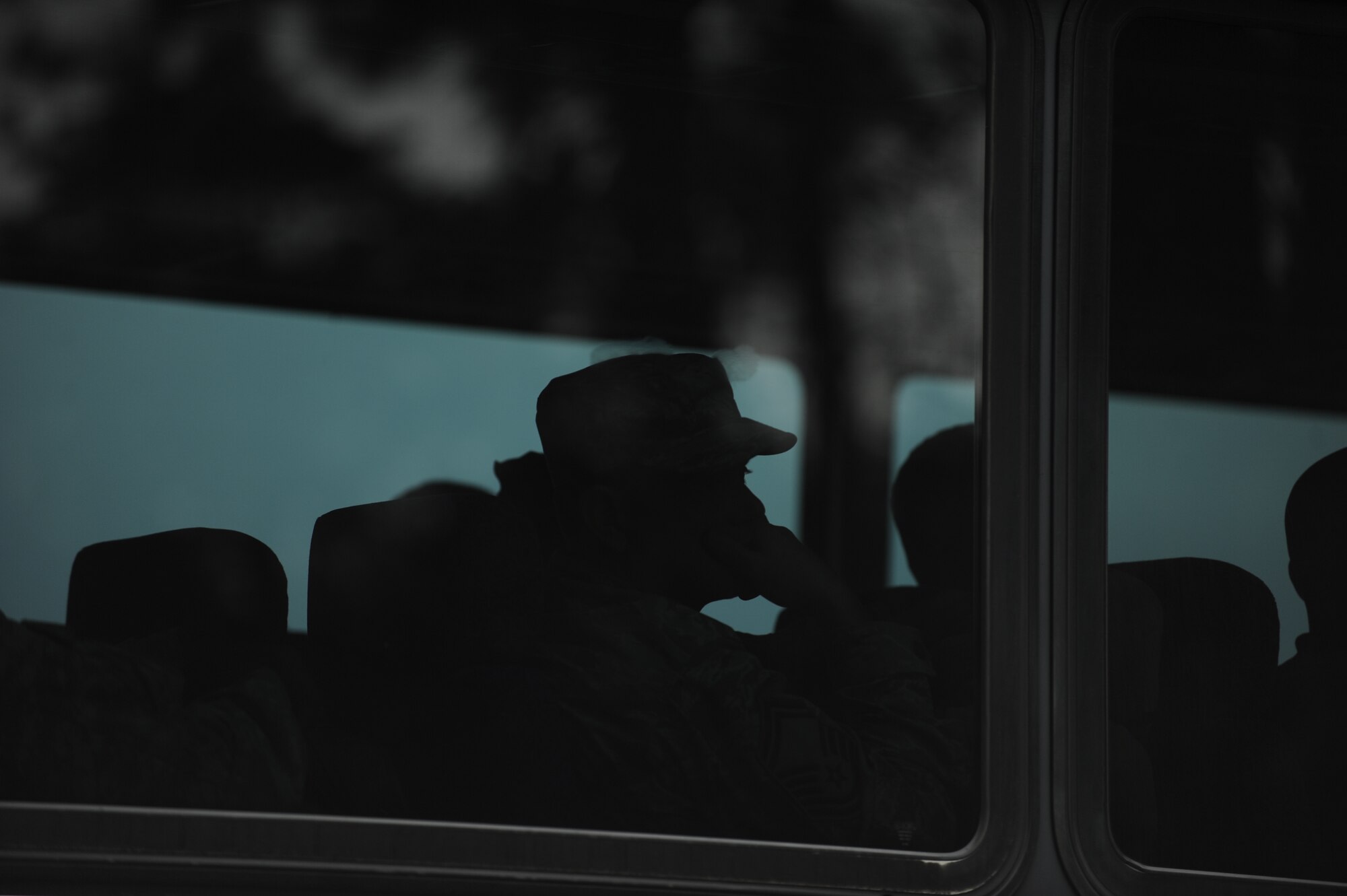 A U.S. Service member waits on a bus transporting personnel returning from missions combatting the Ebola Virus Disease in West Africa at Joint Base Langley-Eustis’ Langley Transit Center, Va., Nov. 13, 2014. The 633rd Air Base Wing established the center as a precedent-setting controlled monitoring area to comfortably house members returning from missions in West Africa. (U.S. Air Force photo by Staff Sgt. Natasha Stannard/Released)