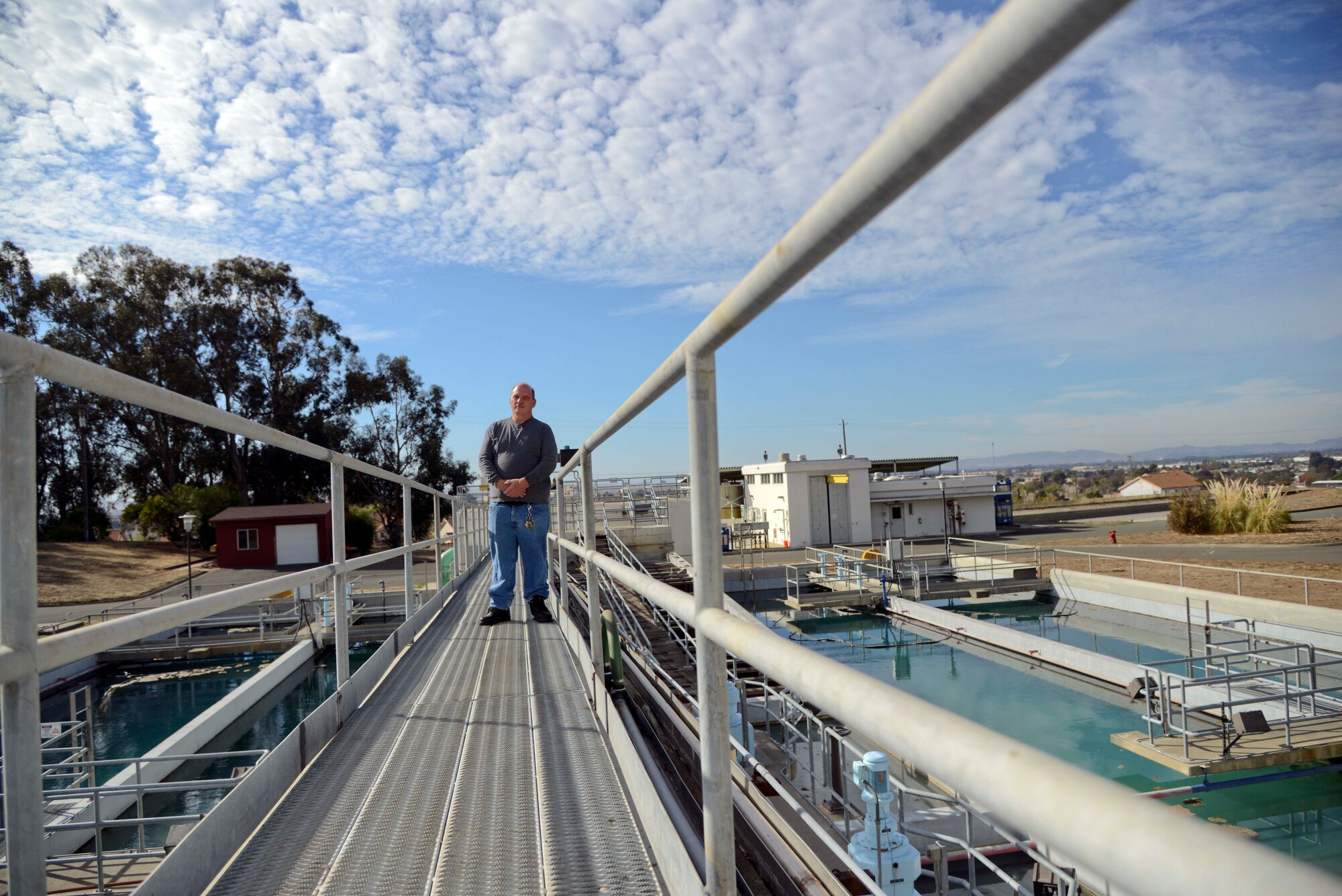 Roger Kasper, senior water treatment plant operator, stands above the water treatment plant on Travis Air Force Base. The water plant provides potable water for mission requirements, as well as the health and safety of more than 10,000 base residents and employees. (U.S. Air Force photo/Senior Airman Madelyn Brown)

