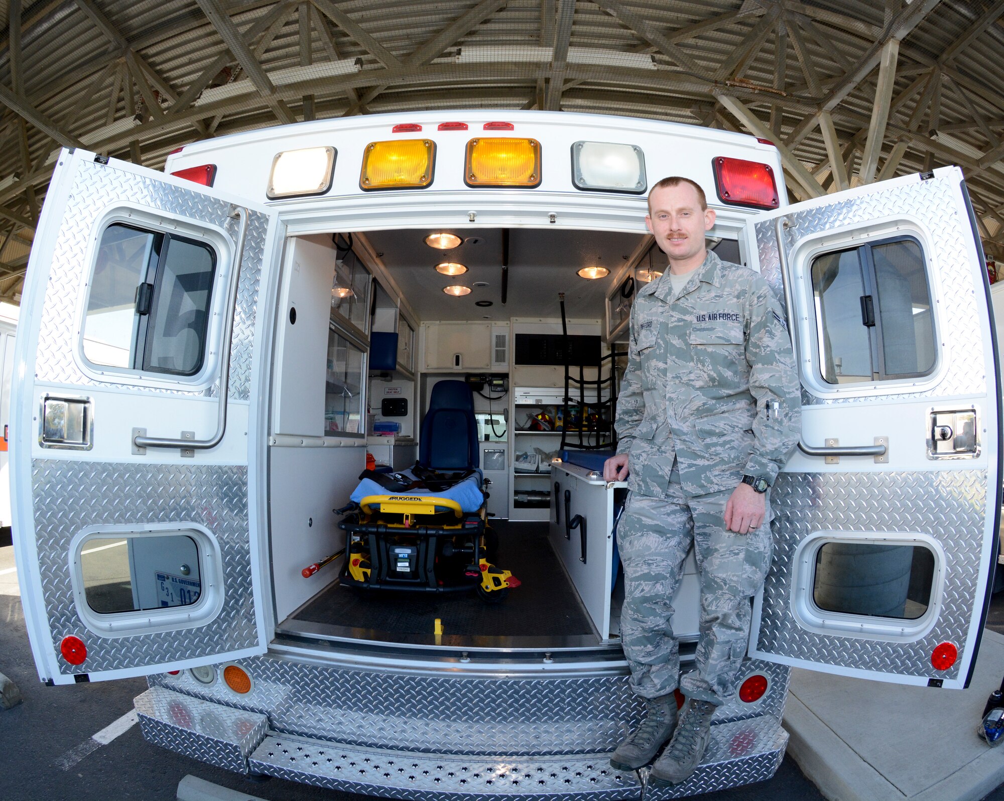 Airman 1st Class Curtis Pufford, 60th Medical Operations Squadron medical technician, poses for a photo Nov. 4 at Travis Air Force Base. Pufford works in the emergency room department at David Grant USAF Medical Center and as an emergency medical technician and ambulance operator for Travis. (U.S. Air Force photo by Airman 1st Class Amber Carter)