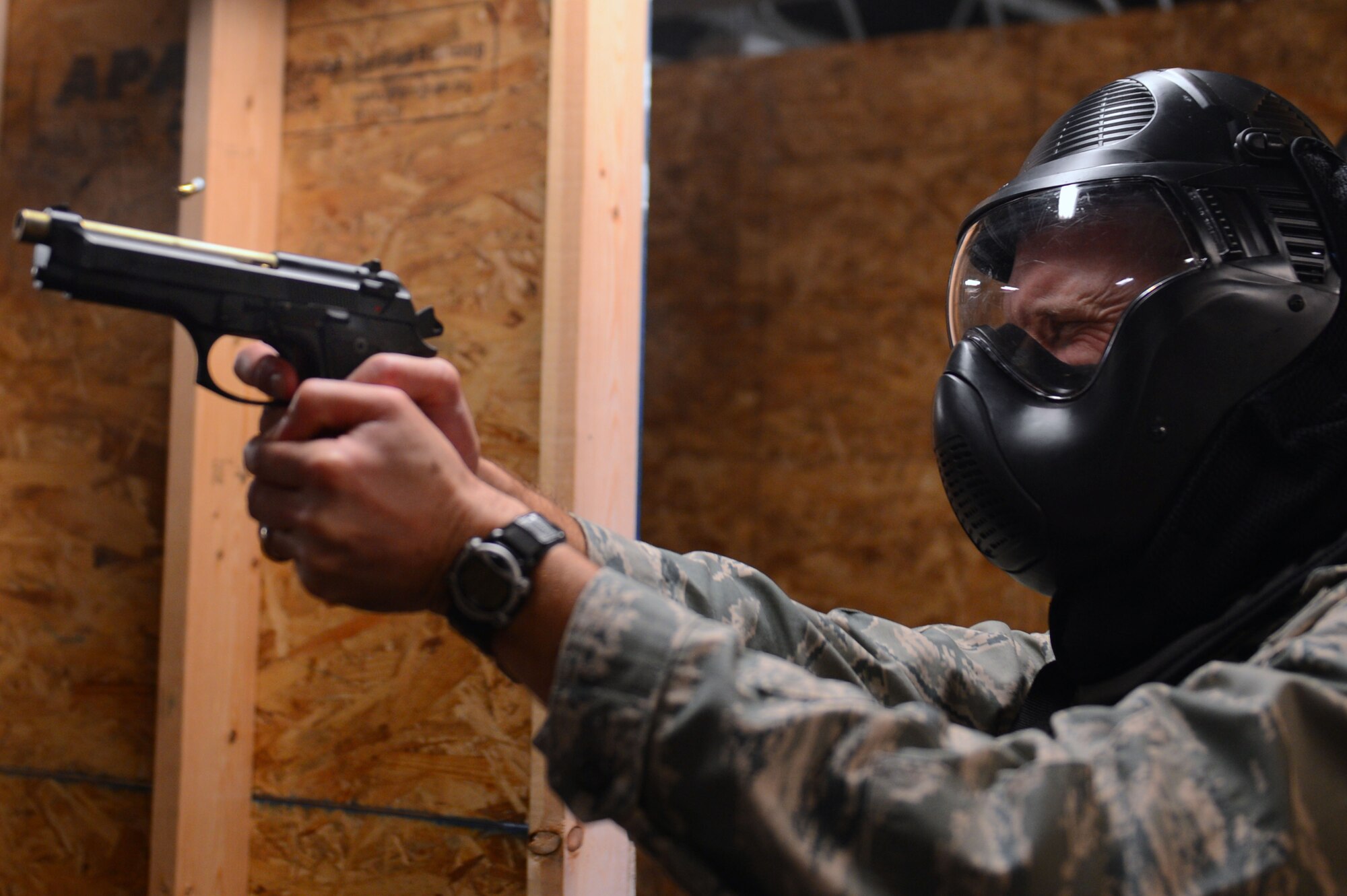 U.S. Air Force Col. Stephen Jost, 20th Fighter Wing commander, maneuvers through the 20th Security Forces Squadron shoot house at Shaw Air Force Base, S.C., Oct. 27, 2014. Jost entered different rooms within the shoot house hitting only targets that were intended to be a threat. (U.S. Air Force photo by Senior Airman Tabatha Zarrella/Released)