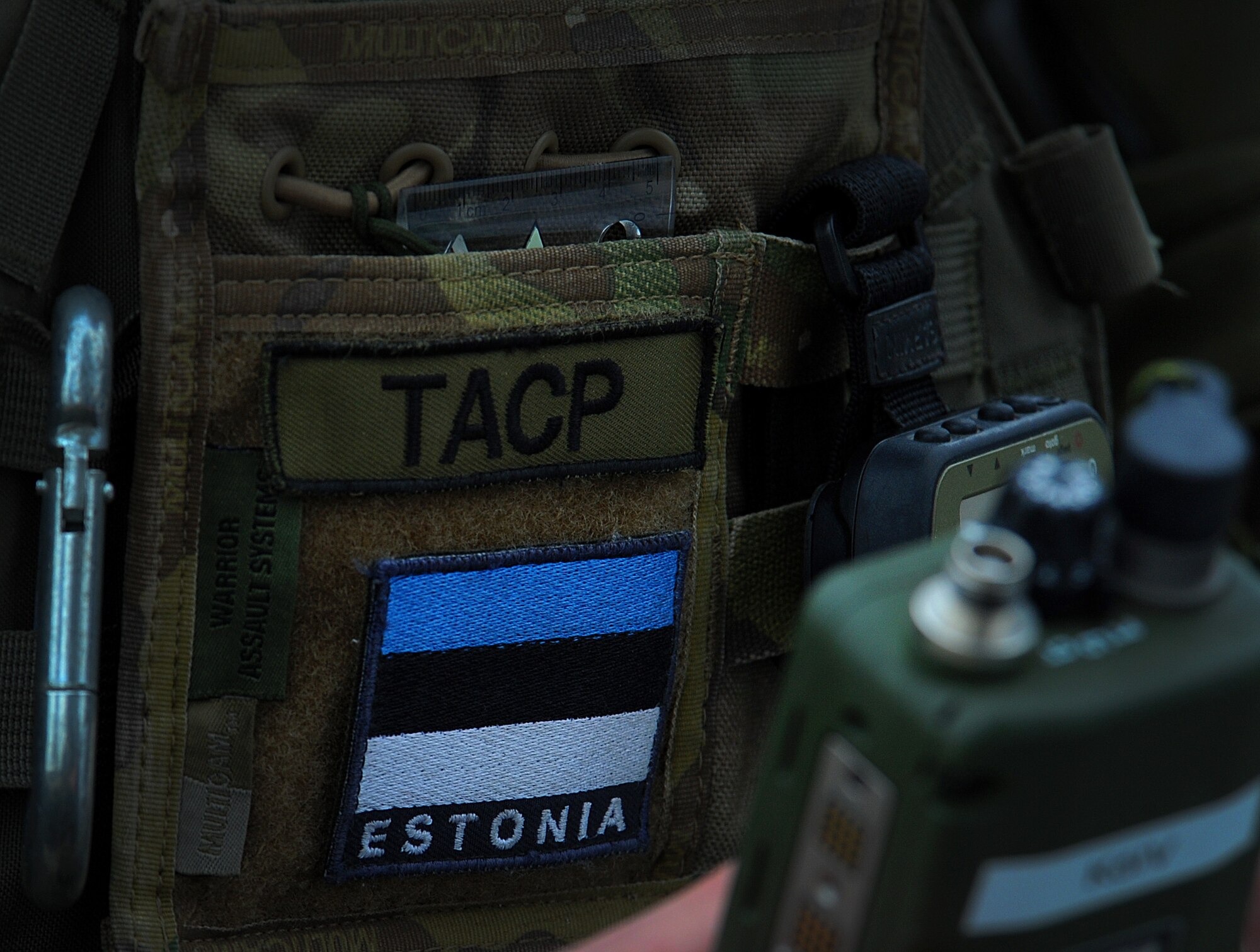 An Estonian air force joint tactical air controller listens to a pilot as he gives his coordinates over a radio Nov. 13, 2014, near Tapa, Estonia. The air-to-ground training is designed to train NATO and U.S forces to work together. (U.S. Air Force photo/Senior Airman Matthew Lotz)