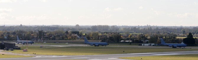 Three KC-135 Stratotankers taxi to take off Nov. 12, 2014, on RAF Mildenhall, England. The three tankers left RAF Mildenhall airspace together in a three-ship takeoff. (U.S. Air Force photo by Gina Randall/Released)
