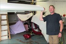 Air Force Reserve Lt. Col. Karl A. Haagsma, a medical entomologist assigned to the 757th Airlift Squadron’s aerial spray flight, stands next to his STOL CH 701 in his workshop, Sept. 9, 2014. Haagsma, a licensed pilot, built the experimental aircraft from scratch and is hoping to fly the plane soon. Courtesy photo.  