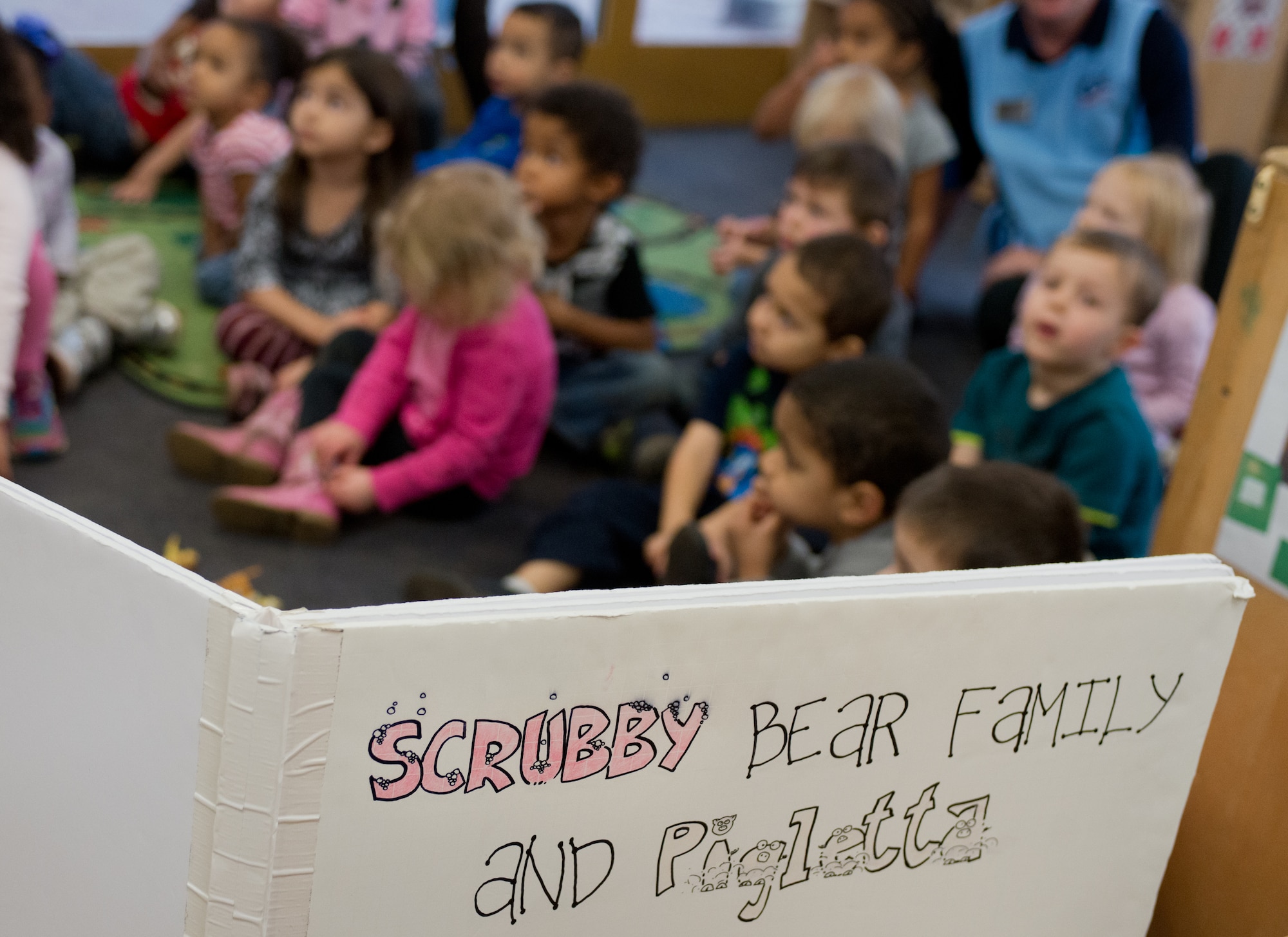 Children from the Ramstein Child Development Center learn the importance of personal hygiene from Scrubby Bear Nov. 13, 2014, at Ramstein Air Base, Germany. The Scrubby Bear program is led by the Red Cross and promotes cleanliness through children stories and song. (U.S. Air Force photo/Senior Airman Jonathan Stefanko)