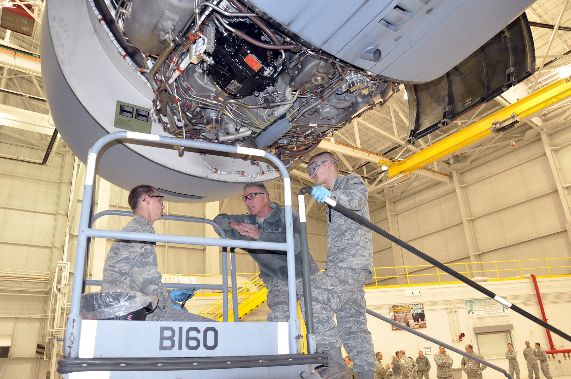 WRIGHT-PATTERSON AIR FORCE BASE, Ohio – Senior Airman Cody Kohrman (left) and Airman Caleb Wiseman (right), 445th Aircraft Maintenance Squadron hydraulic mechanics, demonstrate their work to Brig. Gen. John Flournoy, Jr., Commander, Fourth Air Force, March Air Reserve Base, California, Nov. 1. The general and Chief Master Sgt. Brian C. L. Wong, Fourth Air Force Command Chief Master Sergeant, met with the men and women of the 445th while visiting the wing Oct. 31-Nov. 2. The two also spoke to attendees of the wing’s Employer Appreciation Day and served lunch to wing Airmen at the Pitsenbarger Dining Facility. (U.S. Air Force photo/Capt. Elizabeth Caraway)