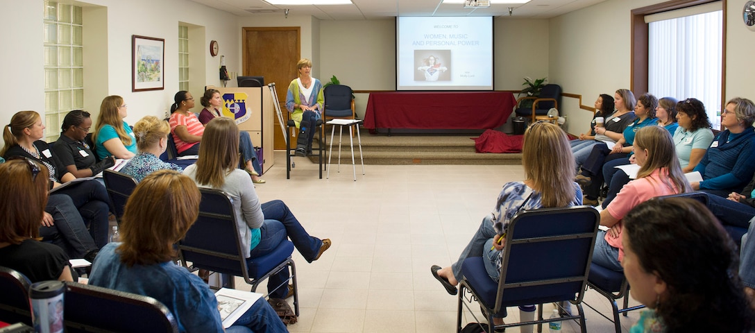Molly Lord, guest speaker, welcomes members of Team Patrick-Cape to a workshop geared toward women, music & personal power, Nov. 7, 2014, at Patrick Air Force Base, Fla. In conjunction with the workshop, Team Patrick-Cape was authorized to wear denim jeans in observance of Denim Day, to recognize the importance of preventing sexual assault. (U.S. Air Force photo/Matthew Jurgens)