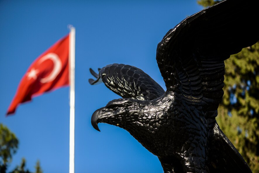 Hundreds of U.S. Air Force personnel and Turkish Air Force personnel gathered in front of the 10th Tanker Command Headquarters building to honor the monument of Mustafa Kemal Ataturk during the Ataturk Memorial Day ceremony Nov. 10, 2014, Incirlik Air Base, Turkey. In Turkey the eagle represents the Turkish AF. (U.S. Air Force photo by Airman Cory W. Bush/Released)