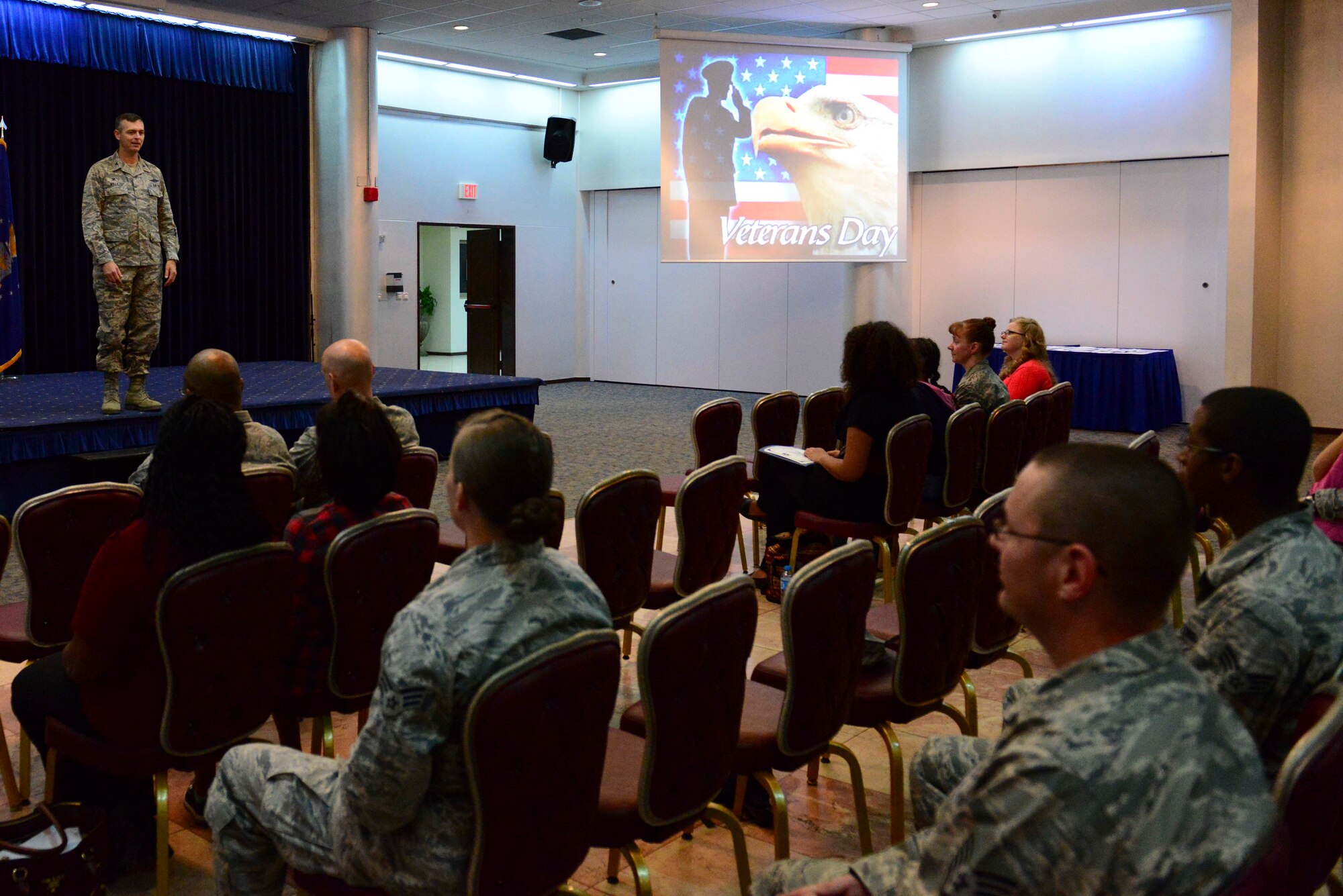 Col.Craig Wills, 39th Air Base Wing commander, speaks at the Veterans Day essay contest, Nov. 10, 2014, Incirlik Air Base, Turkey. Four Incirlik Unit School students entered essays into the contest on the topic of what Veterans Day meant to them. (U.S. Air Force photo by Staff Sgt. Eboni Reams)