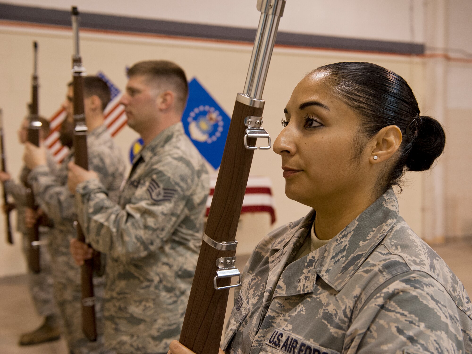 Members of the 65th Air Base Wing Honor Guard practice rifle drills at Lajes Field, Azores, Portugal, Nov. 13, 2014. A ceremonial guardsman is an individual of good reputation, having integrity, ethical conduct and exhibiting standards which merit respect; responsible for protecting and overseeing the maintenance of standards on and off duty. (U.S. Air Force photo/Staff Sgt. Zachary Wolf/Released)