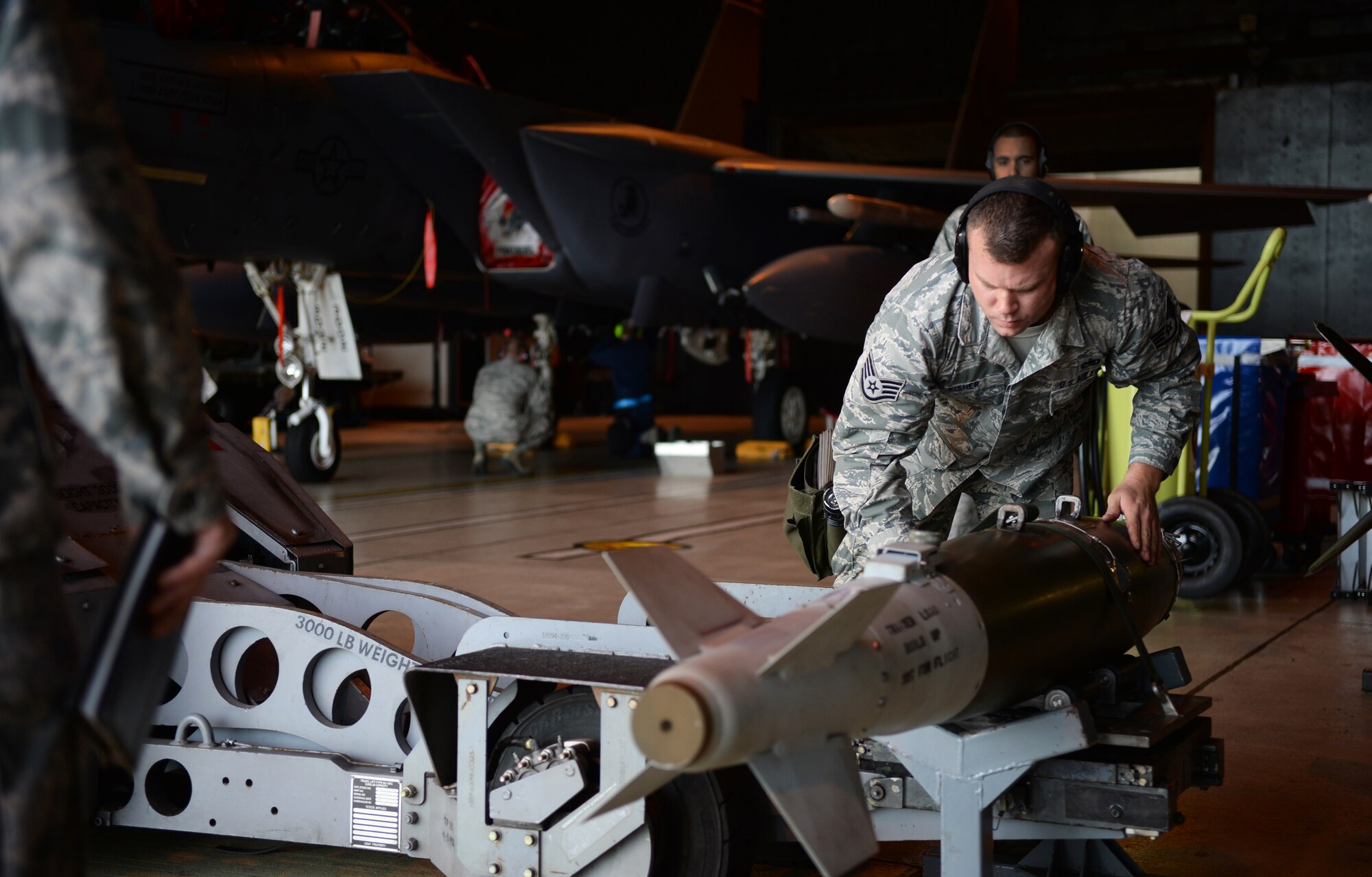 Staff Sgt. Marcus Fisher, 492nd Aircraft Maintenance Unit load crew member, inspects a Guided Bomb Unit-38 munition during a quarterly weapons competition at Royal Air Force Lakenheath, England, Oct. 31, 2014. The competition featured the best load crew teams from the 492nd, 493rd and 494th AMUs and the 48th Munitions Squadron. The winner was determined based on the fastest time loading munitions with the least amount of errors. (U.S. Air Force photo by Staff Sgt. Emerson Nuñez/Released) 