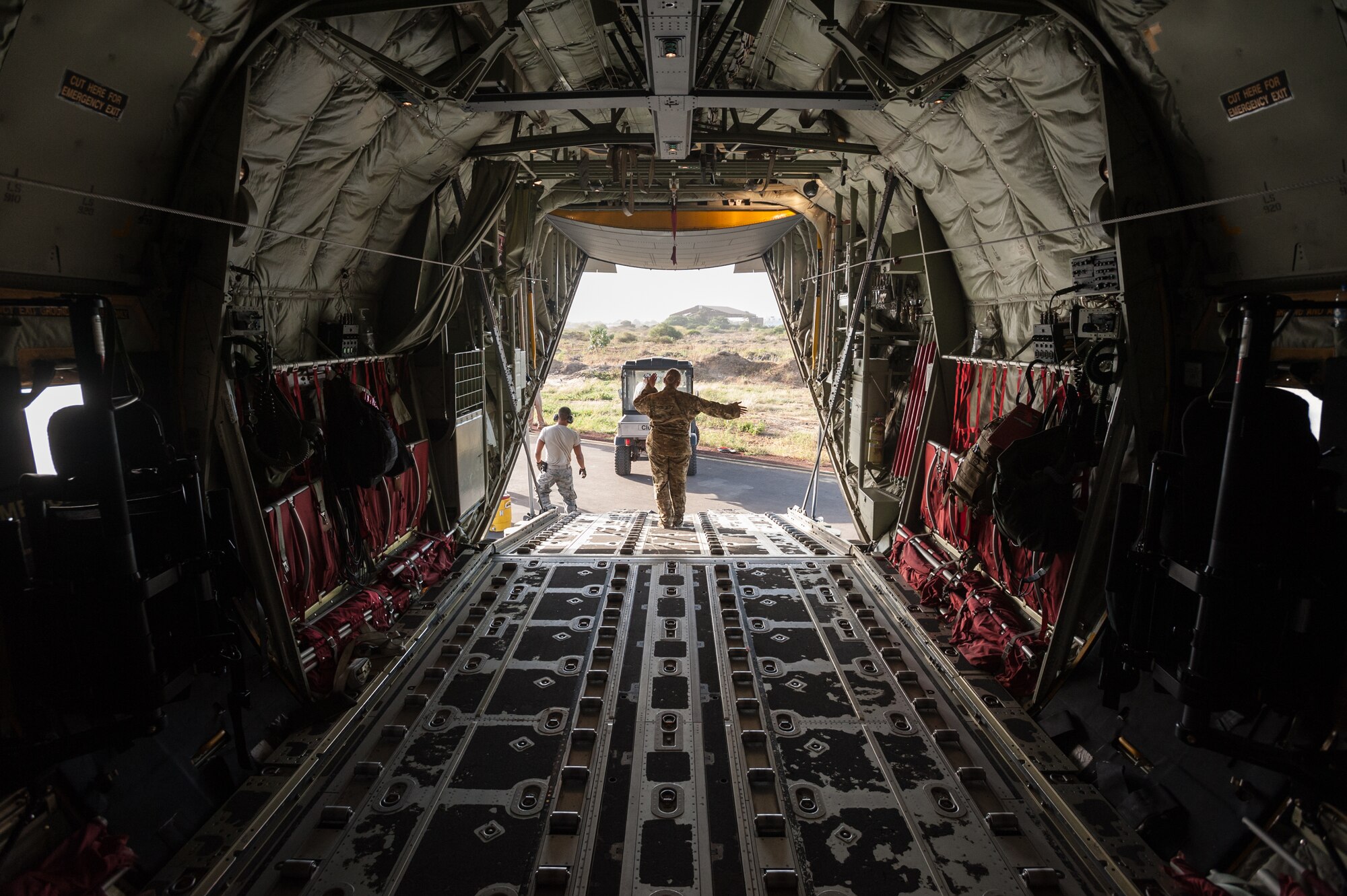 U.S. Air Force Staff Sgt. Kassondra Cline, a loadmaster for the 787th Air Expeditionary Squadron, directs the loading of a tactical vehicle onto a U.S. Air Force C-130J aircraft at Léopold Sédar Senghor International Airport in Dakar, Senegal, Nov. 11, 2014. The aircraft and crew, from Dyess Air Force Base Texas, are deployed to Senegal to fly humanitarian aid and troop-support equipment into Monrovia, Liberia, in support of Operation United Assistance, the U.S. Agency for International Development-led, whole-of-government effort to contain the Ebola virus outbreak in West Africa. (U.S. Air National Guard photo by Maj. Dale Greer)