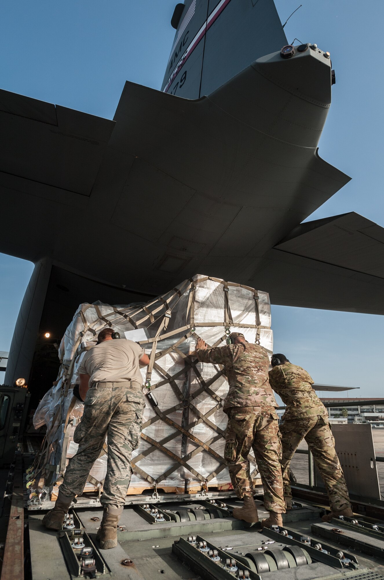 An aerial porter from the Kentucky Air National Guard’s 123rd Contingency Response Group and loadmasters from the 317th Airlift Group at Dyess Air Force Base, Texas, load humanitarian cargo onto a U.S. Air Force C-130J aircraft at Léopold Sédar Senghor International Airport in Dakar, Senegal, Nov. 10, 2014. The aircraft and crew, all from Dyess, are deployed to Senegal as part of the 787th Air Expeditionary Squadron and will fly the cargo into Monrovia, Liberia, in support of Operation United Assistance, the U.S. Agency for International Development-led, whole-of-government effort to contain the Ebola virus outbreak in West Africa. (U.S. Air National Guard photo by Maj. Dale Greer)
