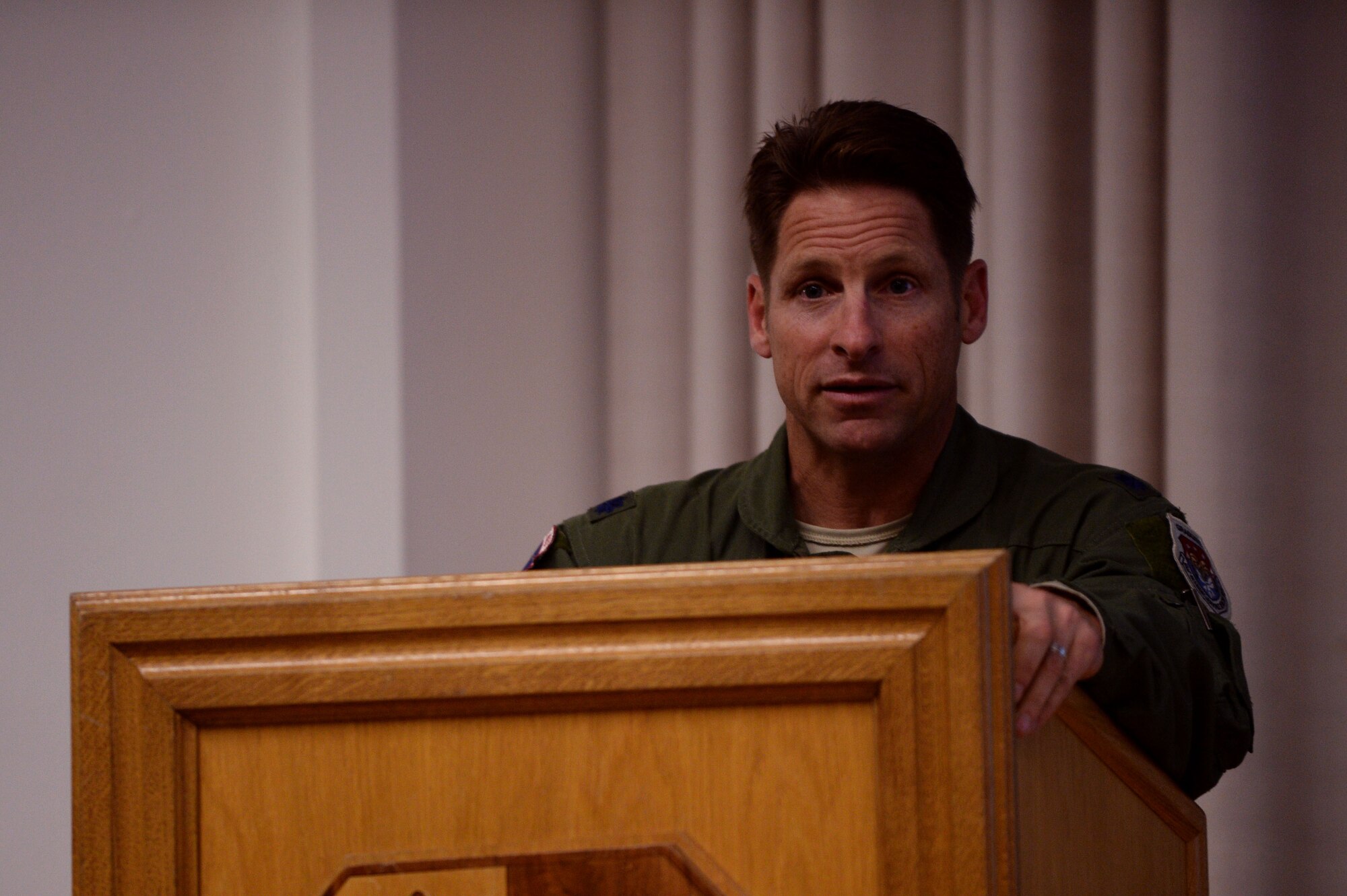 U.S. Air Force Lt. Col. Dan Murray, 52nd Aerospace Medicine Squadron commander and 52nd Fighter Wing public health emergency officer, speaks at a wing information forum Nov. 13, 2014, at the theater at Spangdahlem Air Base, Germany, regarding the Ebola virus disease, or EVD. As the PHEO, Murray leads the public health emergency working group, which tracks health threats that may affect base Airmen. (U.S. Air Force photo by Staff Sgt. Daryl Knee/Released)