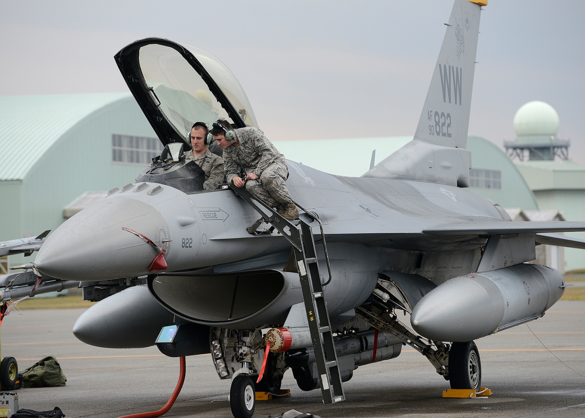 U.S. Air Force Staff Sgt. Steve Runger and Airman 1st Class Christian Cherven, 14th Aircraft Maintenance Unit avionics technicians, perform operations checks on various systems on an F-16 Fighting Falcon at Komatsu Air Base, Japan, Nov. 12, 2014. This F-16 is one of several from Misawa Air Base, Japan, participating in the Aviation Training Program at Komatsu. The ATR program directs U.S. Air Force units to conduct training away from their duty station to provide a noise respite for those living in the community surrounding their home station. During this ATR, more than 120 Airmen and pilots from Misawa relocated to Komatsu to practice and evaluate the coordination procedures and interoperability elements required to effectively and mutually respond to the defense of Japan, or to a regional crisis or contingency situation in the Asia-Pacific region, while also building bilateral confidences and working relationships. (U.S. Air Force photo by Staff Sgt. Alyssa C. Wallace/Released)