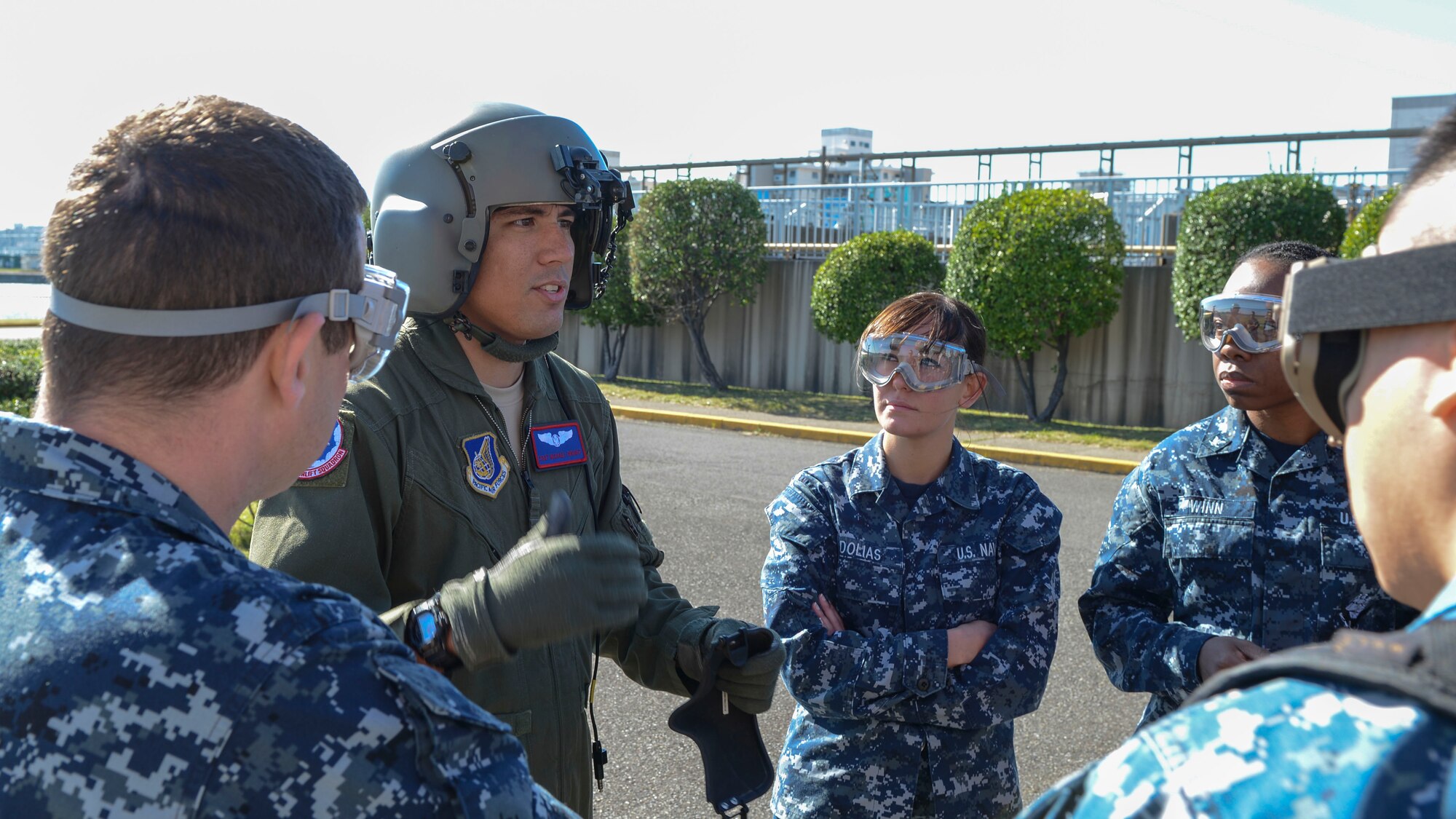 Staff Sgt. Michael Wright, 459th Airlift Squadron flight engineer, briefs a group of seaman on aeromedical evacuation using the UH-1N Huey during Exercise Keen Sword 2015 at Yokosuka Naval Station, Japan, Nov. 13, 2014. Approximately 11,000 U.S. personnel participated in the latest chapter of Keen Sword, including members from multiple branches of service. (U.S. Air Force photo by Airman 1st Class Soo C. Kim/Released)