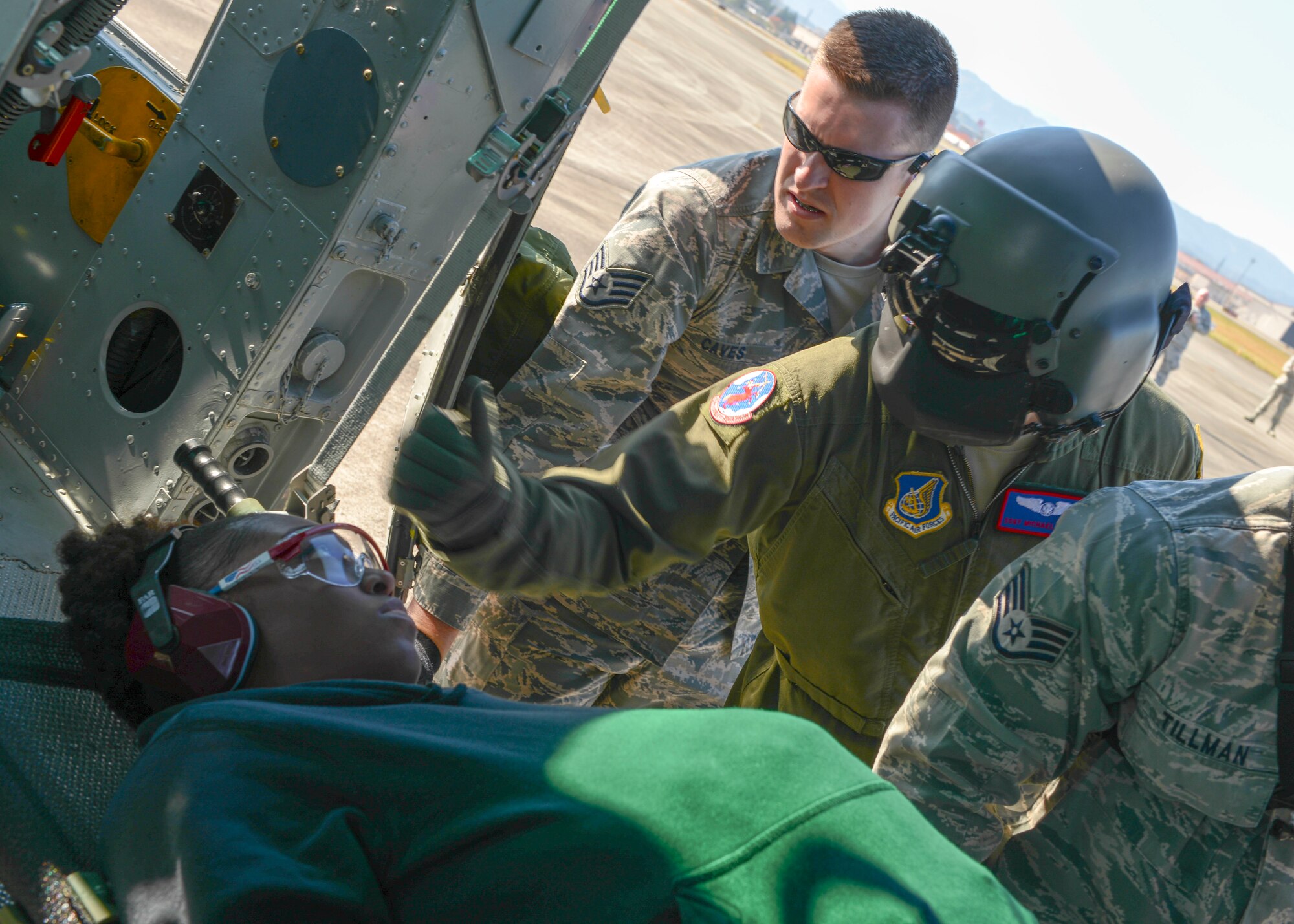 Staff Sgt. Michael Wright, 459th Airlift Squadron flight engineer, inspects a litter’s stability before a UH-1N Huey takes off with a simulated patient during Exercise Keen Sword 2015 at Yokota Air Base, Japan, Nov. 13, 2014. The patient was loaded and carried from Yokota to Yokosuka Naval Station, Japan, to simulate aeromedical evacuation. (U.S. Air Force photo by Airman 1st Class Soo C. Kim/Released)