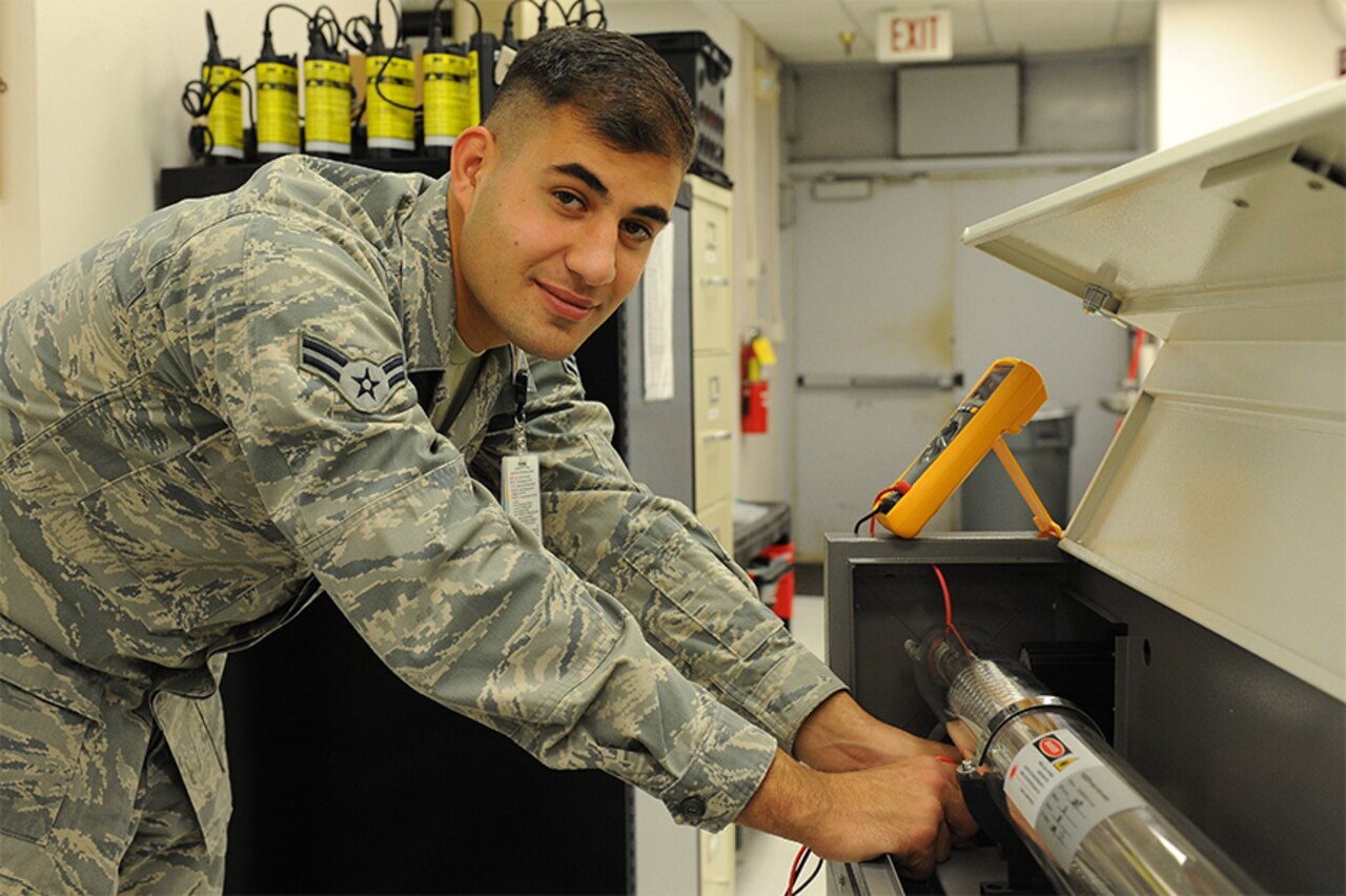 Airman 1st Class Theo Shakir fixes a piece of medical equipment Oct. 29, 2014, at Scott Air Force Base, Ill. U.S. Air Force photo.
