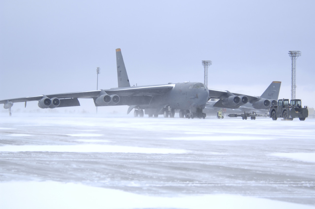 A B-52H Stratofortress bomber sits on the tarmac to be prepped by its crew for flight during a wintry day at Minot Air Force Base in North Dakota, Jan. 8, 2014. U.S. Air Force photo by Airman 1st Class Christopher Boitz