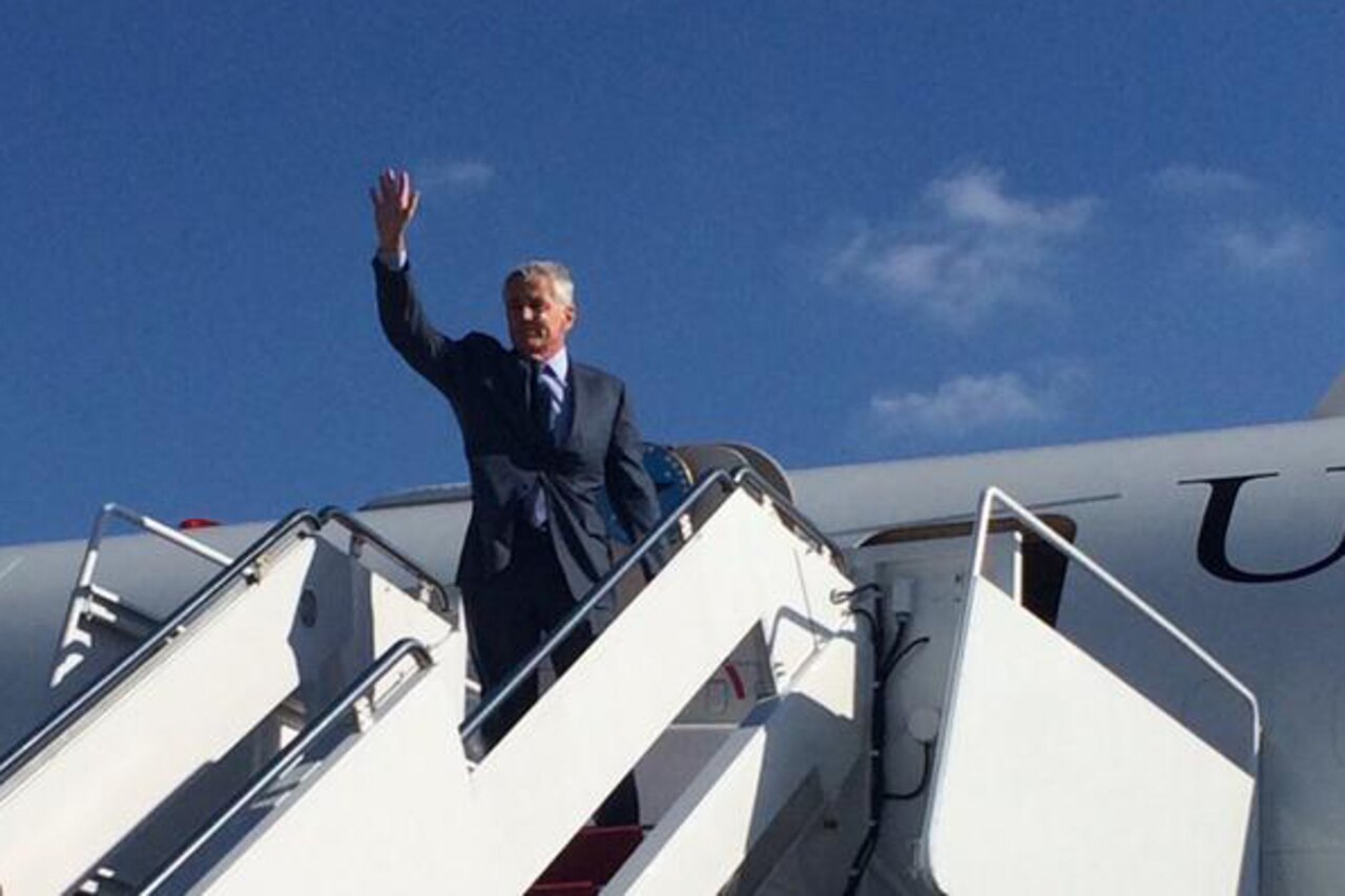 Defense Secretary Chuck Hagel waves before boarding a plan on Joint Base Andrews, Md., to begin a five-day trip across the country to meet with the men and women of the Defense Department, Nov. 14, 2014. The trip includes visits to Minot Air Force Base, N.D., Fort Irwin, Calif., Fort Campbell, Ky., and Camp LeJeune, N.C. DoD photo by U.S. Marine Corps Sgt. Cassandra Flowers 