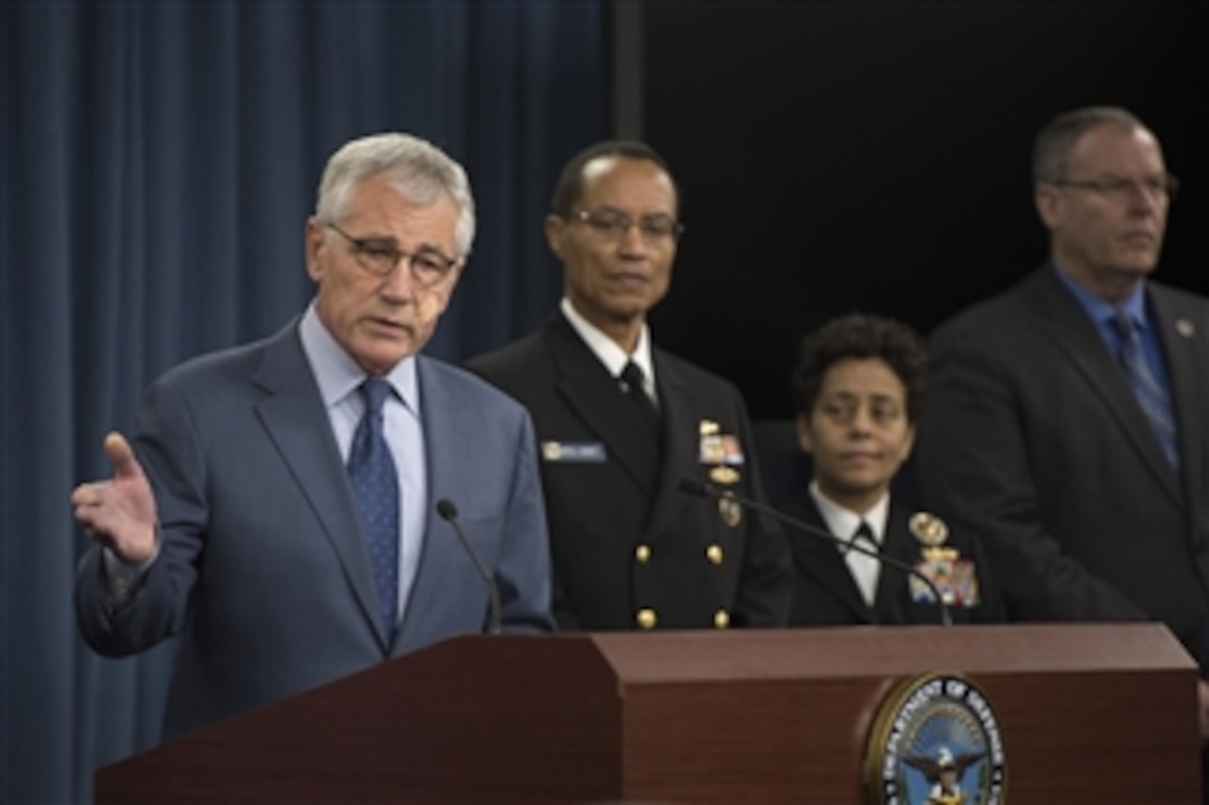 Defense Secretary Chuck Hagel, with Deputy Defense Secretary Bob Work, far right, and Navy leaders, announces a series of reforms to the nuclear enterprise during a press briefing at the Pentagon in Washington, D.C., Nov. 14, 2014. 