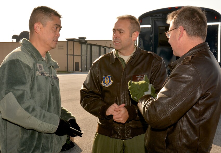 Chief Master Sergeant Brian Wong, Command Chief Master Sergeant, Fourth Air Force, talks about training on the flightline with Chief Master Sgt. Jose Tamayo, Squadron Superintendent, Aeromedical Evacuation Squadron, and Chief Master Sgt. Shane Cayson, Chief of Current Operations, AES, during a visit to the 932nd Airlift Wing. This was Chief Wong's first visit to Scott Air Force Base. Fourth Air Force has command supervision of the Reserve's long-range airlift and air-refueling units located throughout the continental United States, Hawaii and Guam. (U.S. Air Force Photo/ Staff Sgt. Amber Hodges)