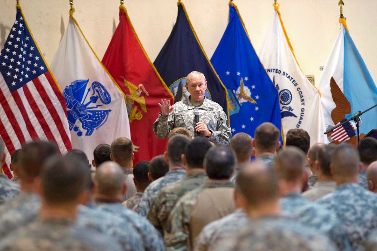 U.S. Army Gen. Martin E. Dempsey, chairman of the Joint Chiefs of Staff, talks with U.S. service members during a town hall meeting in Baghdad, Iraq, Nov. 15, 2014. Dempsey addressed questions that ranged from Iraq's long-term ability to resist threats to the U.S. rebalance in the Asia-Pacific. DoD photo by D. Myles Cullen