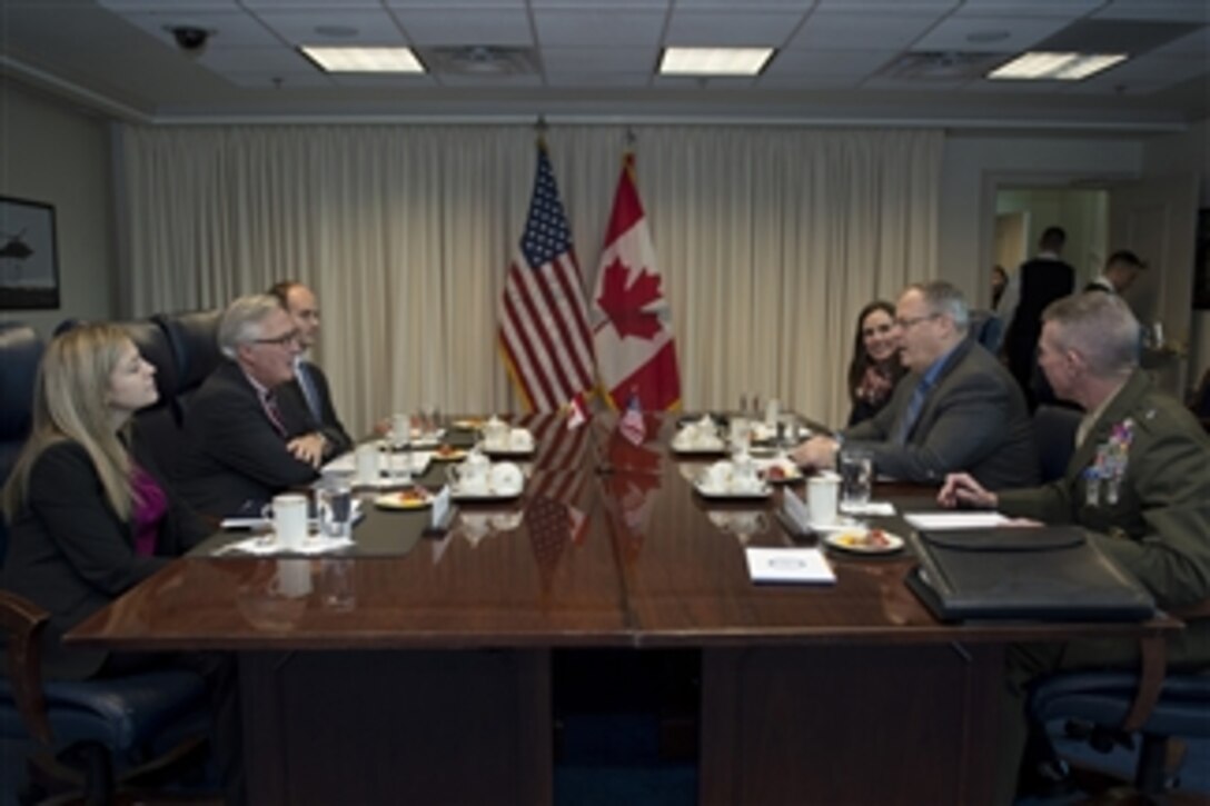 U.S. Deputy Defense Secretary Bob Work, second right, meets with Canadian Deputy Defense Minister Richard Fadden, second left, at the Pentagon, Nov. 14, 2014. Leaders discussed global security challenges and the collaboration on counter-ISIL operations. 