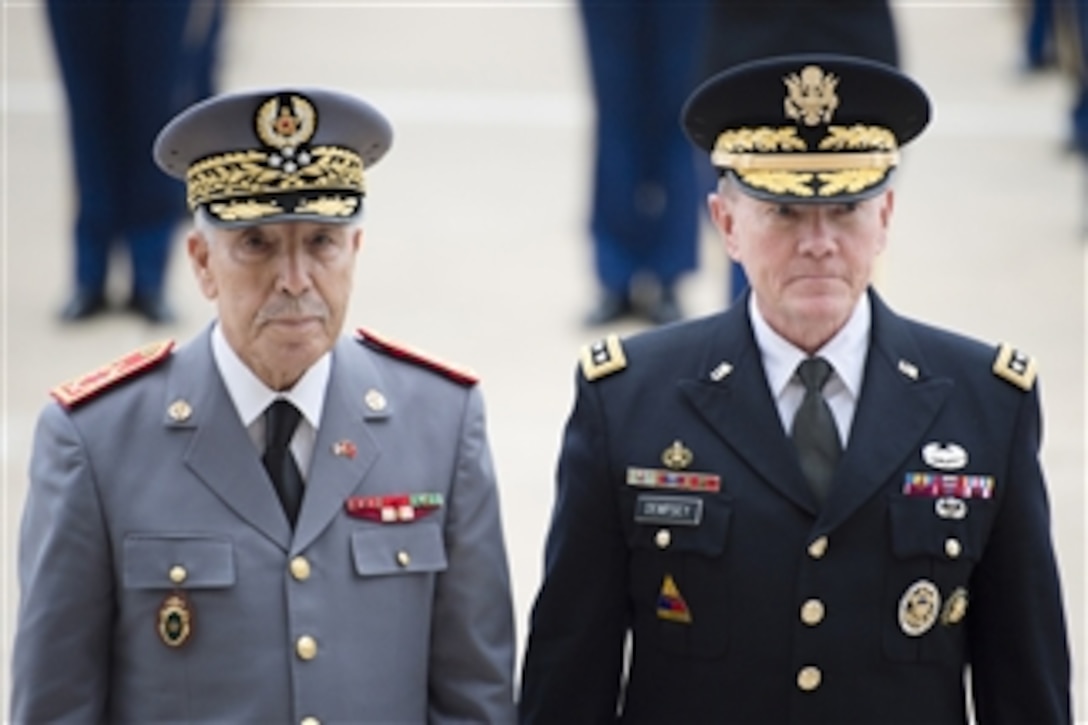 U.S. Army Gen. Martin E. Dempsey, chairman of the Joint Chiefs of Staff, escorts Moroccan Inspector General of the Armed Forces Gen. Bouchaib Arroub through an honor cordon at the Pentagon, Nov. 13, 2014.