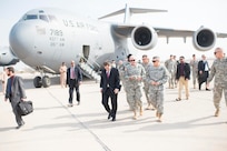 U.S. Ambassador to Iraq, Stuart E. Jones, Chairman of the Joint Chiefs of Staff, Gen. Martin E. Dempsey and Chief of Office of Security Cooperation-Iraq Lt. Gen. John M. Bednarek go to a meeting immediately following the Chairman's arrival at the airport in Baghdad, Iraq, Nov. 15, 2014. Dempsey is visiting Iraq to meet with deployed US service members, U.S. civilian and local Iraqi leadership. 