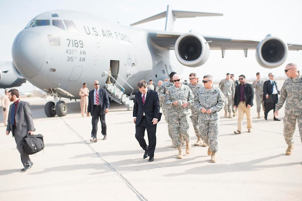 U.S. Ambassador to Iraq, Stuart E. Jones, Chairman of the Joint Chiefs of Staff, Gen. Martin E. Dempsey and Chief of Office of Security Cooperation-Iraq Lt. Gen. John M. Bednarek go to a meeting immediately following the Chairman's arrival at the airport in Baghdad, Iraq, Nov. 15, 2014. Dempsey is visiting Iraq to meet with deployed US service members, U.S. civilian and local Iraqi leadership. 