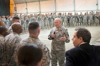 U.S. Chairman of the Joint Chiefs of Staff, Army Gen. Martin E. Dempsey addresses questions from U.S. military members during a town hall meeting in Baghdad, Iraq, Nov. 15, 2014. Dempsey provided his insights and addressed questions to the US military members deployed in support of Operation Inherent Resolve. 