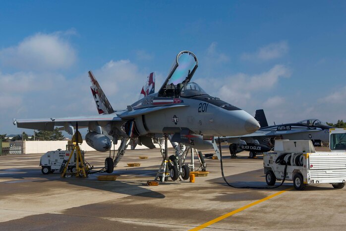 An F/A-18 hornet with Marine Fighter Attack Squadron 115 awaits maintenance during Exercise Max Thunder 14-2, aboard Kunsan Air Base, Republic Of Korea, Nov. 14, 2014. Max Thunder is a semi-annual training event consisting of composite and coalition flight training between the U.S. military and the ROK Force with a main focus on air combat tactics, close air support, and combat search and rescue. 