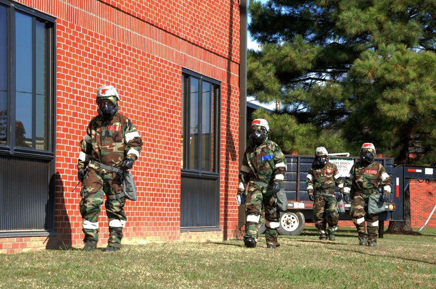 Members of the 188th Communications Flight don their mission oriented protective posture gear during an ability to survive and operate exercise at Ebbing Air National Guard Base, Fort Smith, Ark., Nov. 2, 2014. The objective of the exercise was to test the wing’s ability to react to various attacks. (U.S. Air National Guard photo by Airman 1st Class Cody Martin/released)