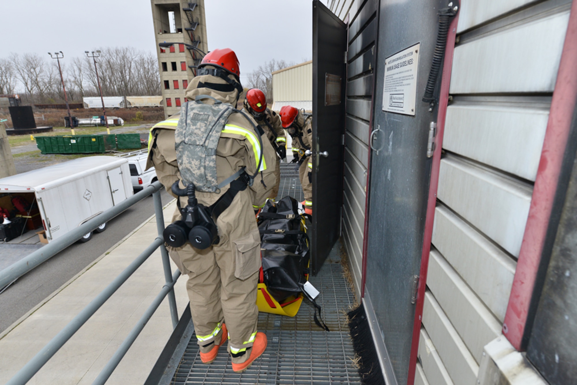 A Fatality Search and Recovery Team from the 107th AW Force Sustainment Flight carry a stretcher during a Homeland Response Force exercise at Cheektowaga, N.Y.  Emergency Services Training & Operations Center on Nov. 15, 2014 (US. Air National Guard Photo/Staff Sgt. Ryan Campbell).