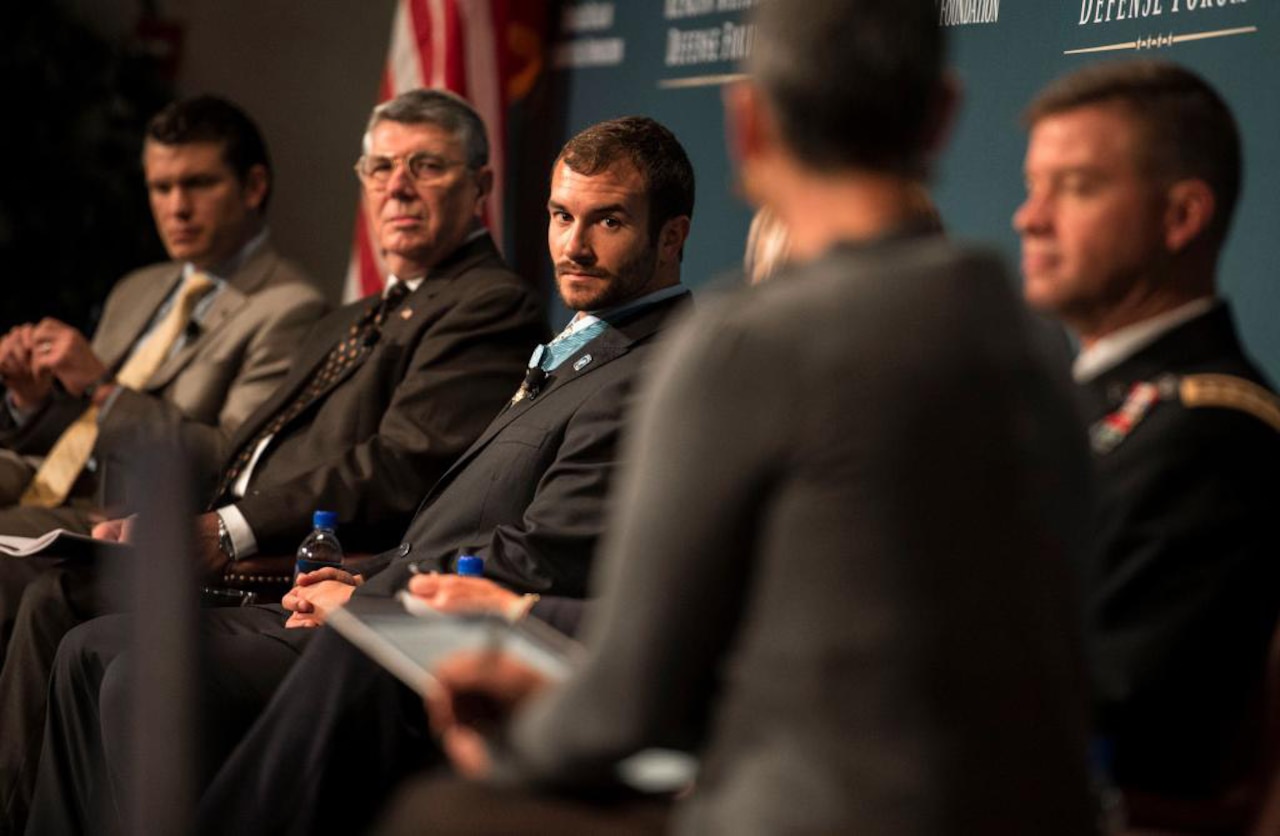Medal of Honor recipient former Army Staff Sgt. Salvatore A. Giunta, center, takes part in a panel discussion at the Reagan National Defense Forum at the Ronald Reagan Presidential Library in Simi Valley, Calif., Nov. 15, 2014. DoD photo by Kevin O'Brien